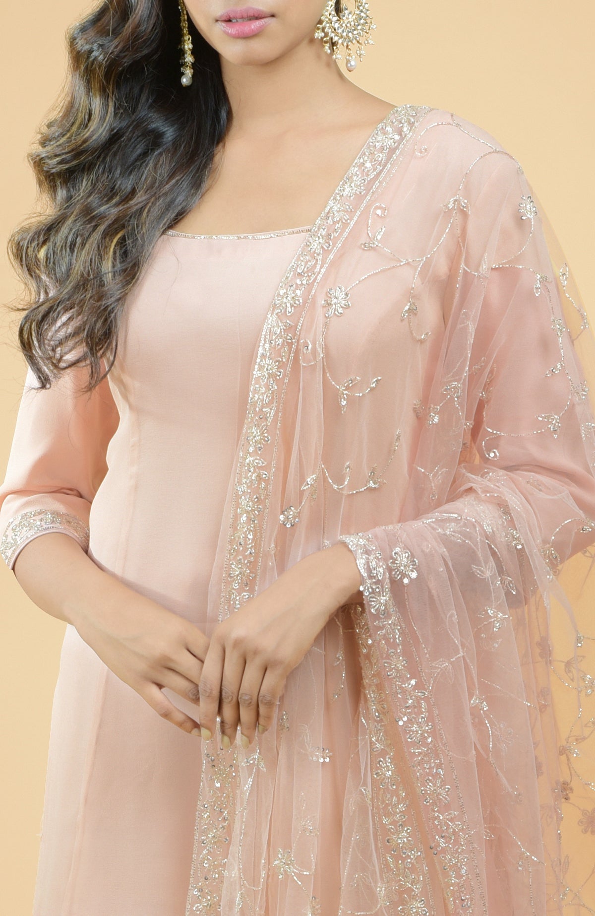 Nude pink georgette sharara set with hand-embroidered chikankari, beads, and sequin zardozi details