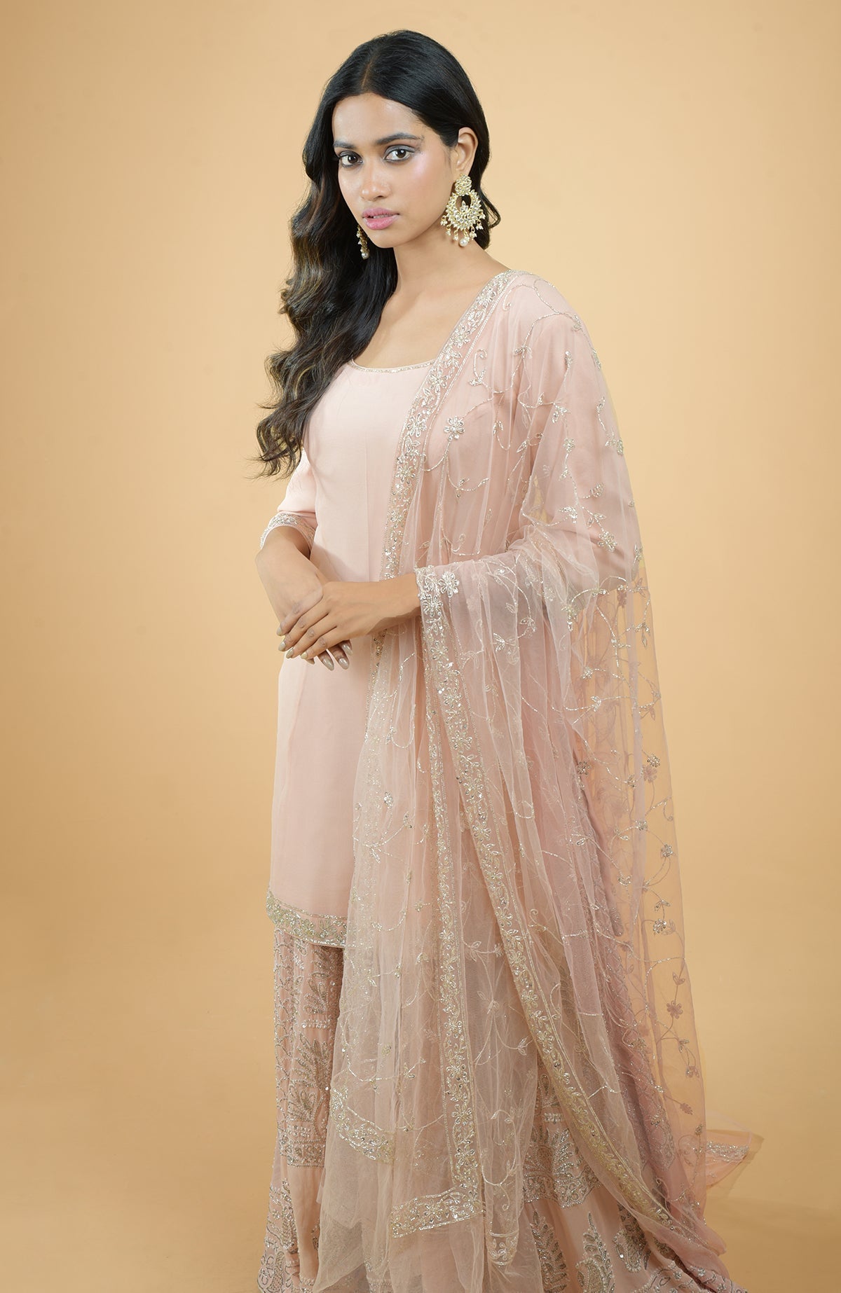 Nude pink sharara set with hand-embroidered chikankari, bead, and sequin zardozi work