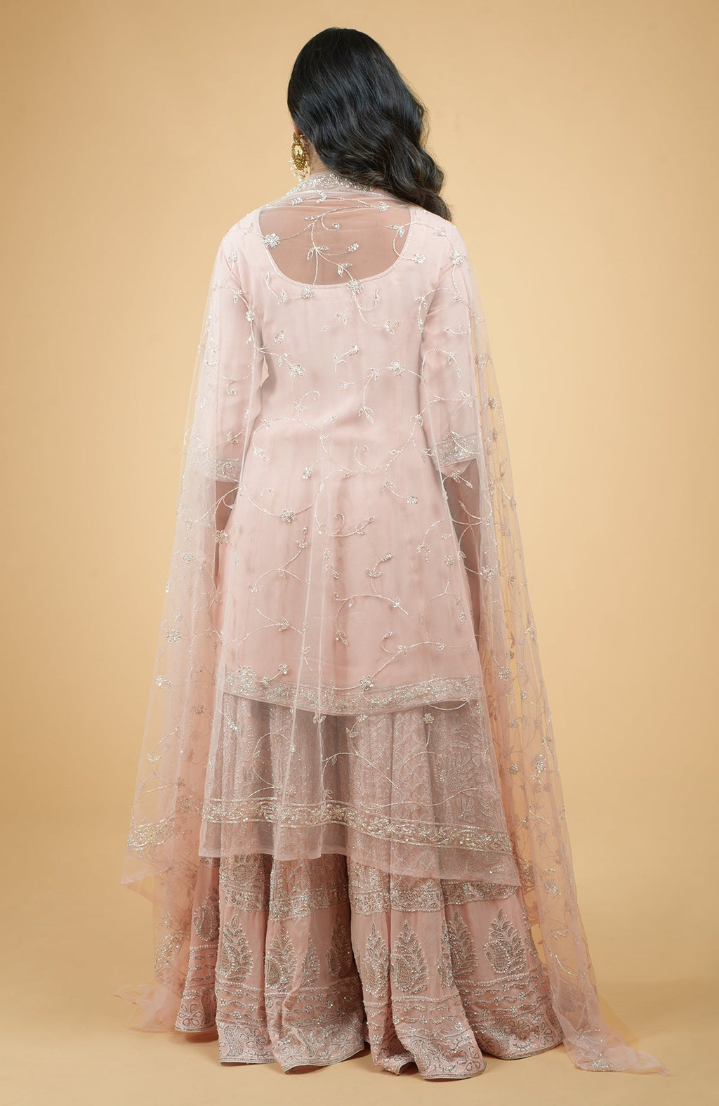 Nude pink georgette sharara set with hand-embroidered chikankari, beads, and sequin zardozi details