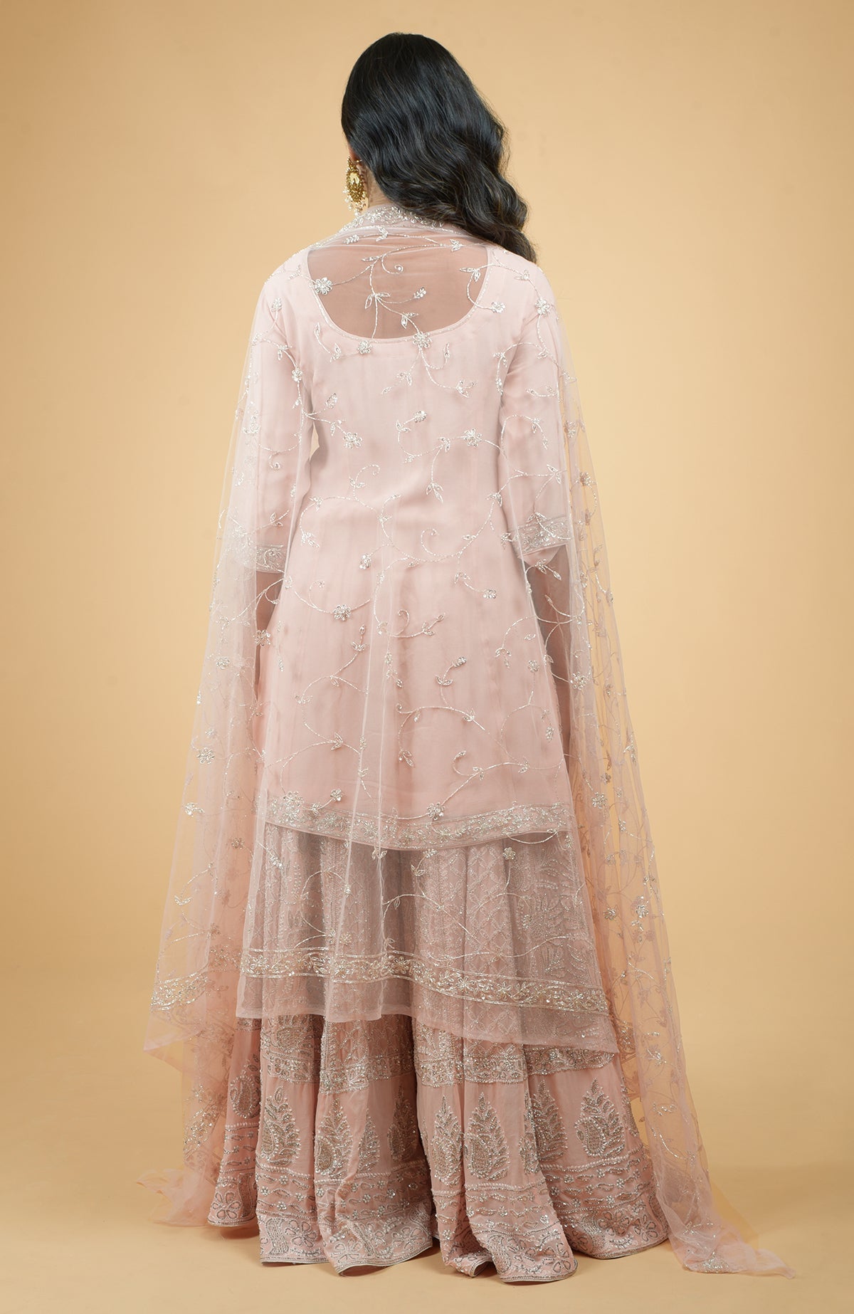 Nude pink georgette sharara set with hand-embroidered chikankari, beads, and sequin zardozi details