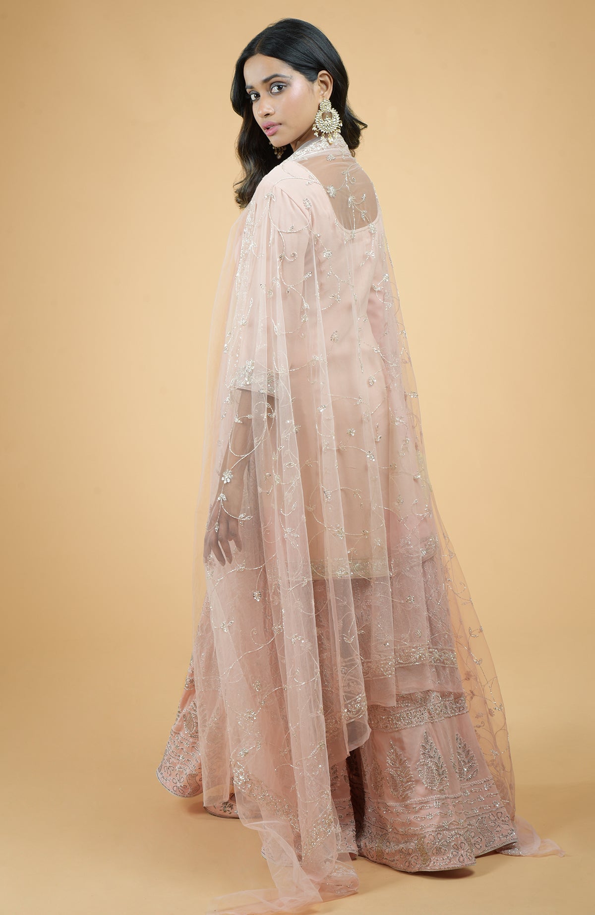 Nude pink sharara set with hand-embroidered chikankari, beads, and sequin zardozi details