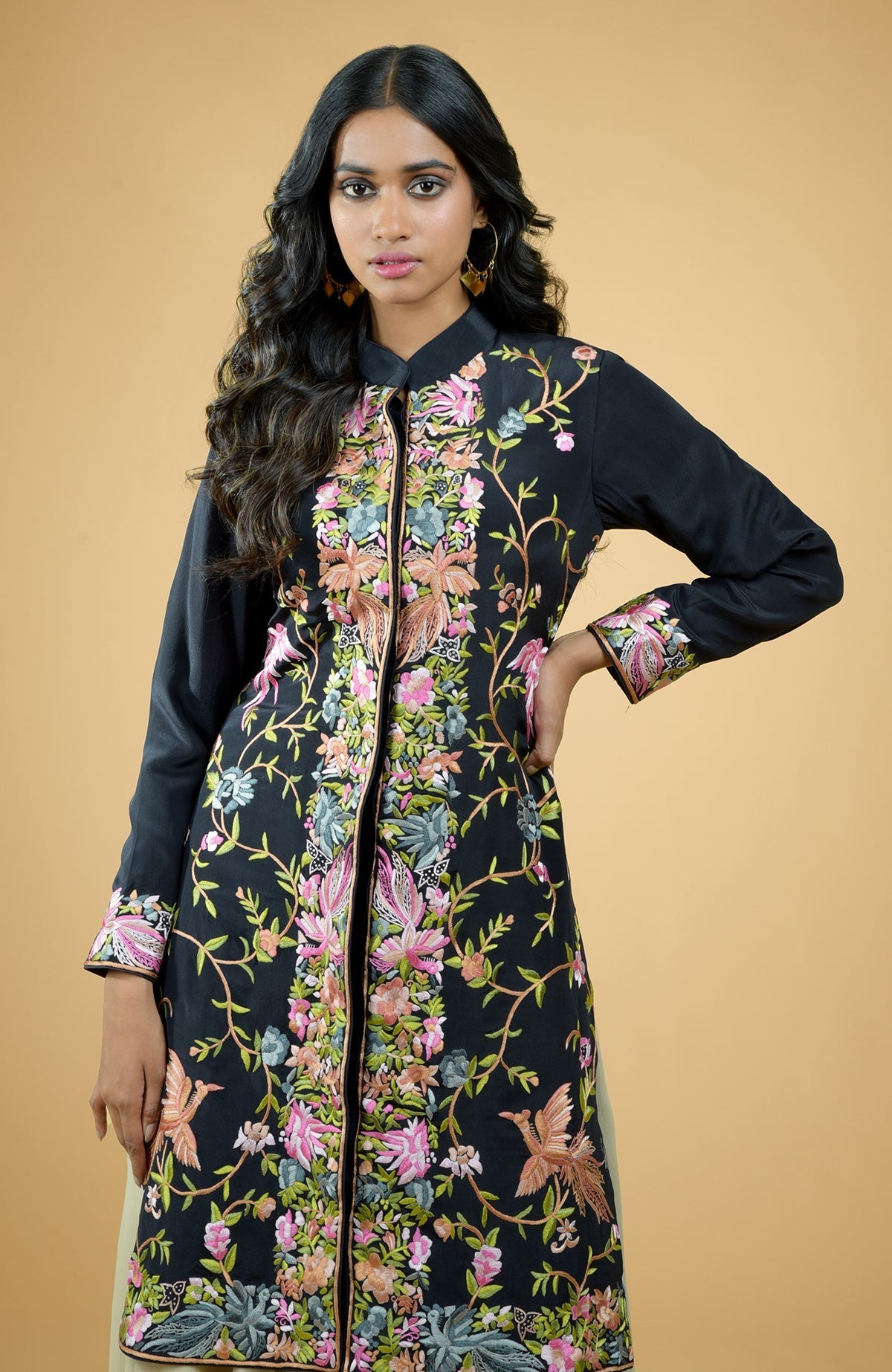 Black Parsi Gara embroidered crepe jacket with floral and bird motifs paired with light gold chiffon skirt