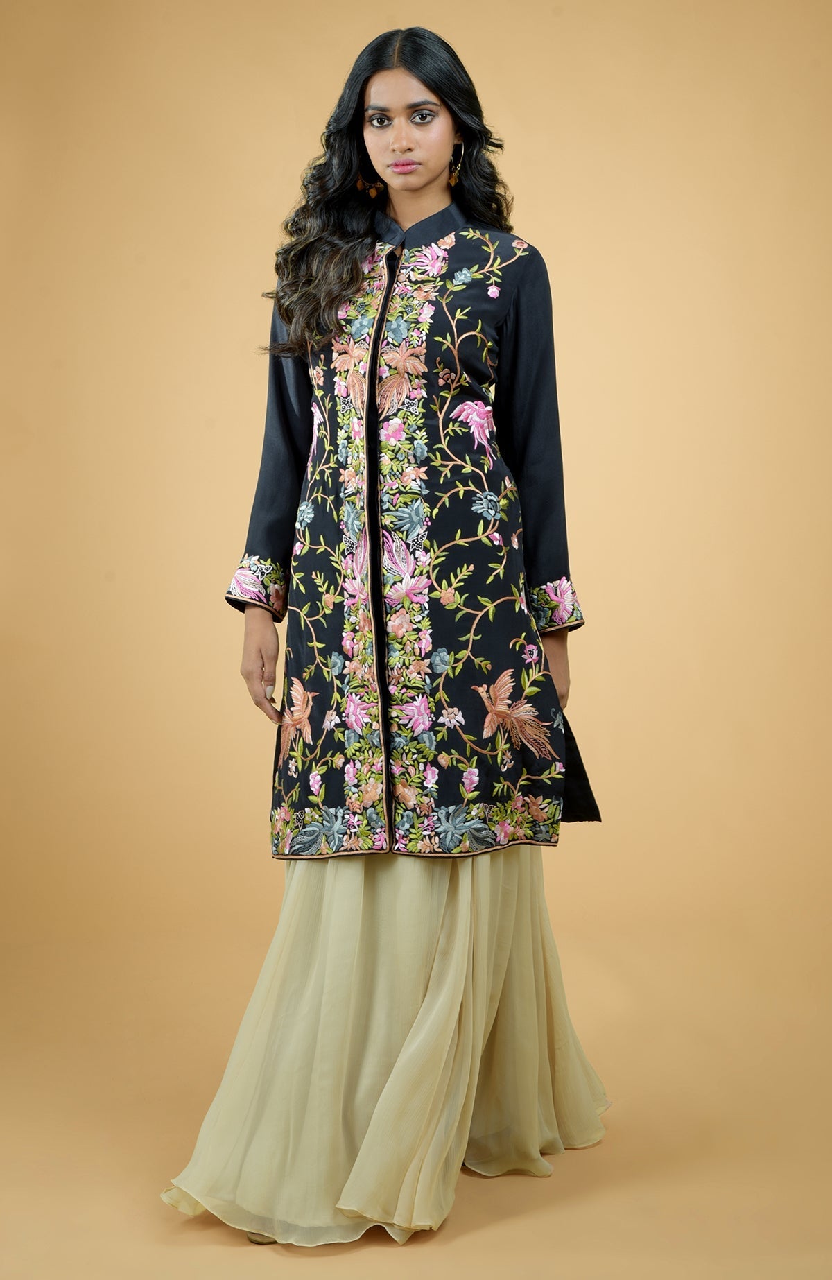 Black Parsi Gara embroidered crepe jacket with floral and bird motifs paired with light gold chiffon skirt