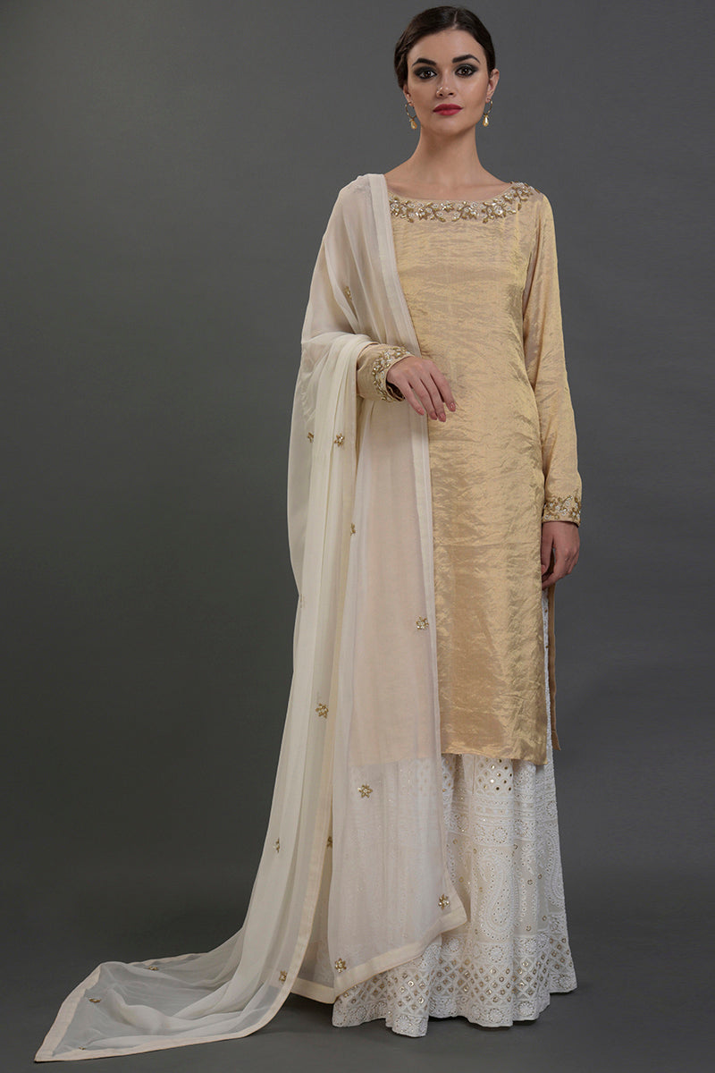 Ivory-gold silk tissue kurta with chikankari embroidery paired with georgette sharara and dupatta