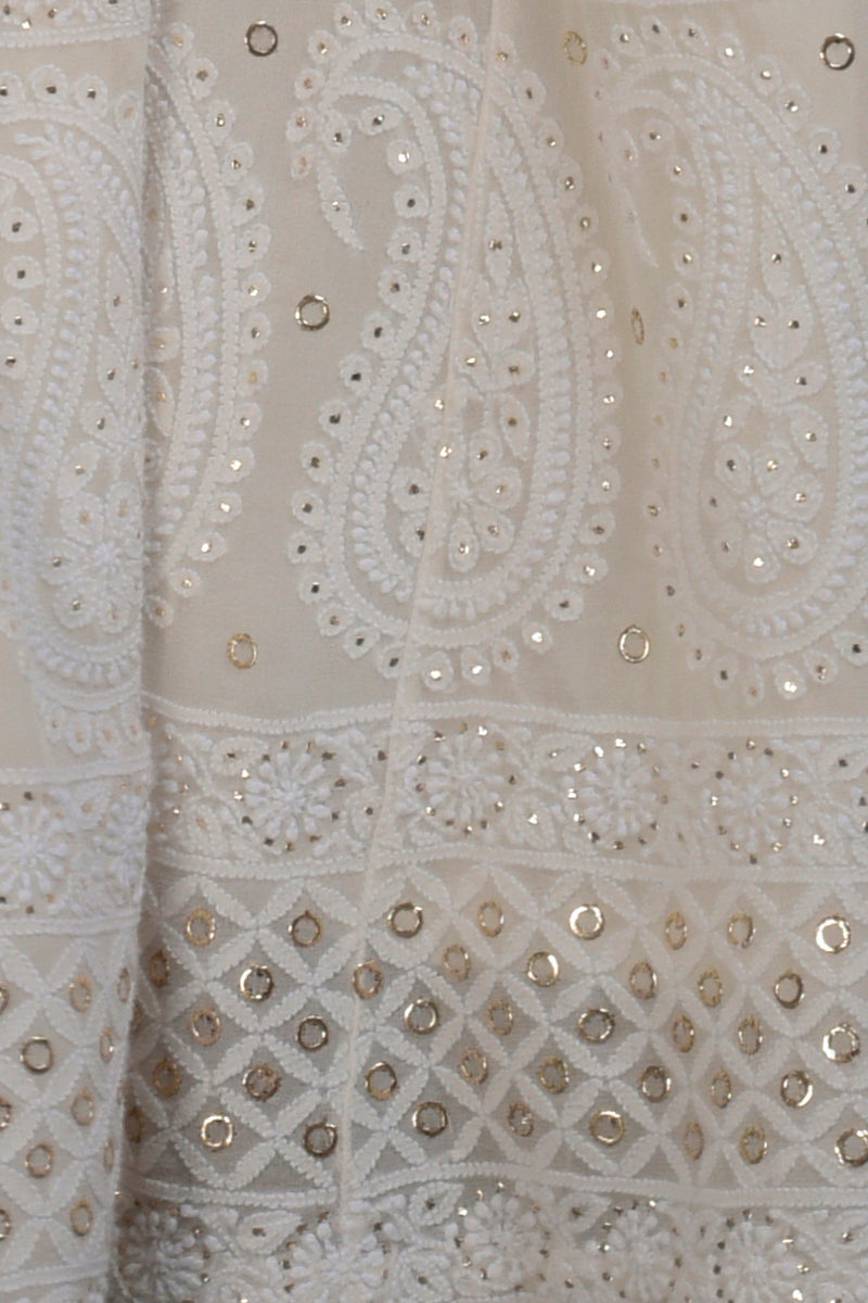 Ivory-gold silk tissue kurta with chikankari and zardozi embroidery paired with georgette sharara and dupatta