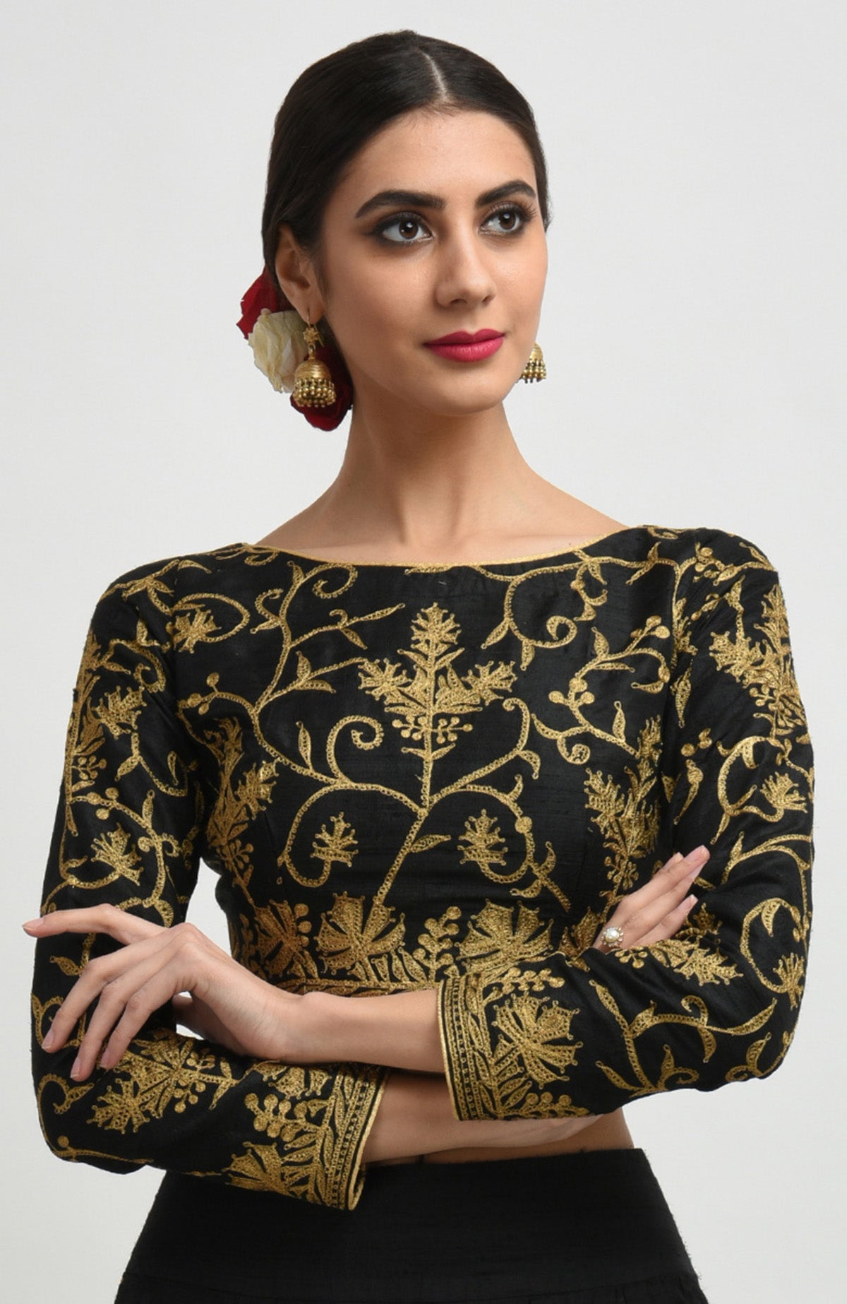 Black raw silk lehenga set with gold Kashmiri tilla aari embroidery and net dupatta.