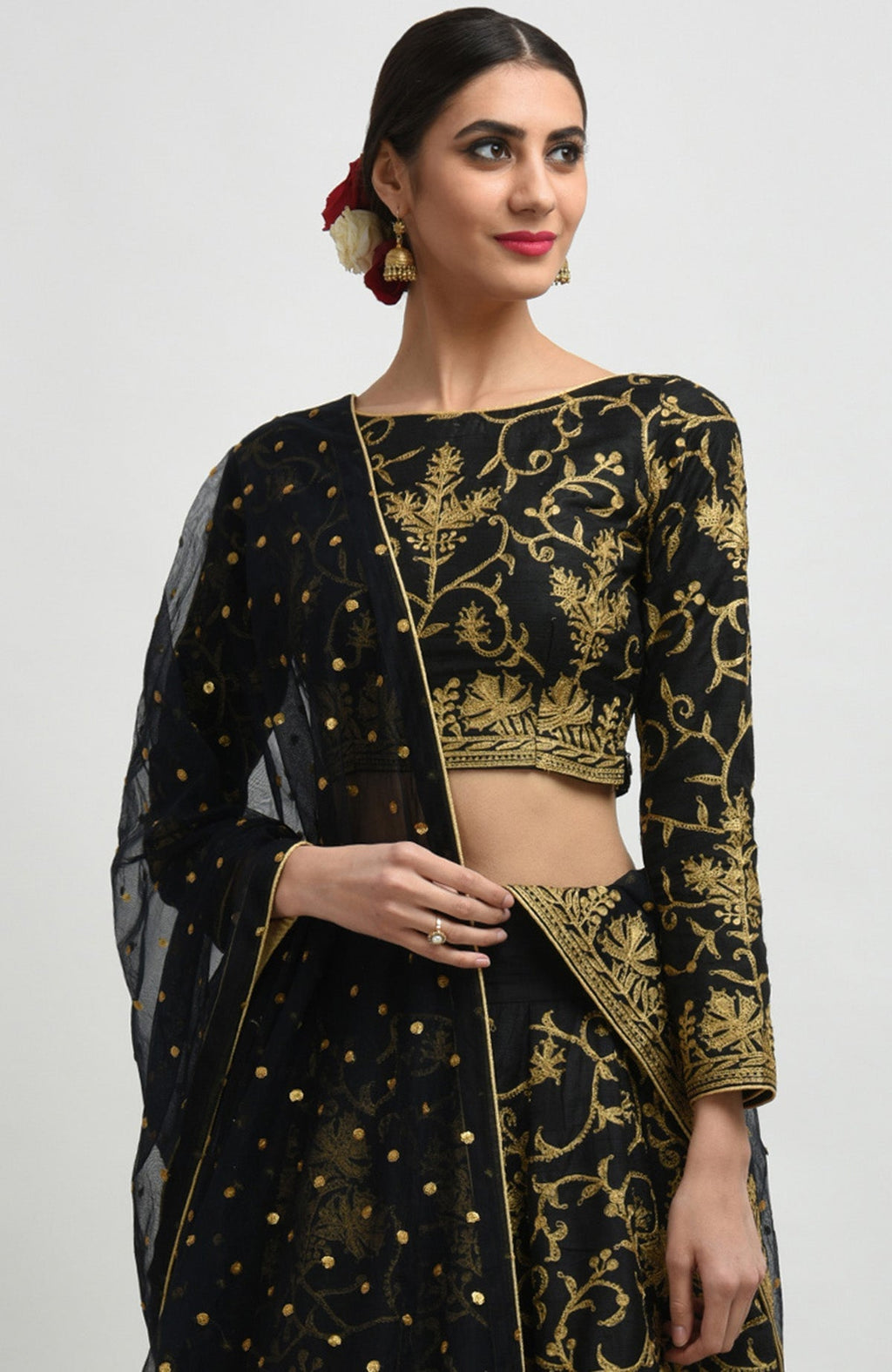Black raw silk lehenga set with gold Kashmiri tilla aari embroidery and net dupatta.