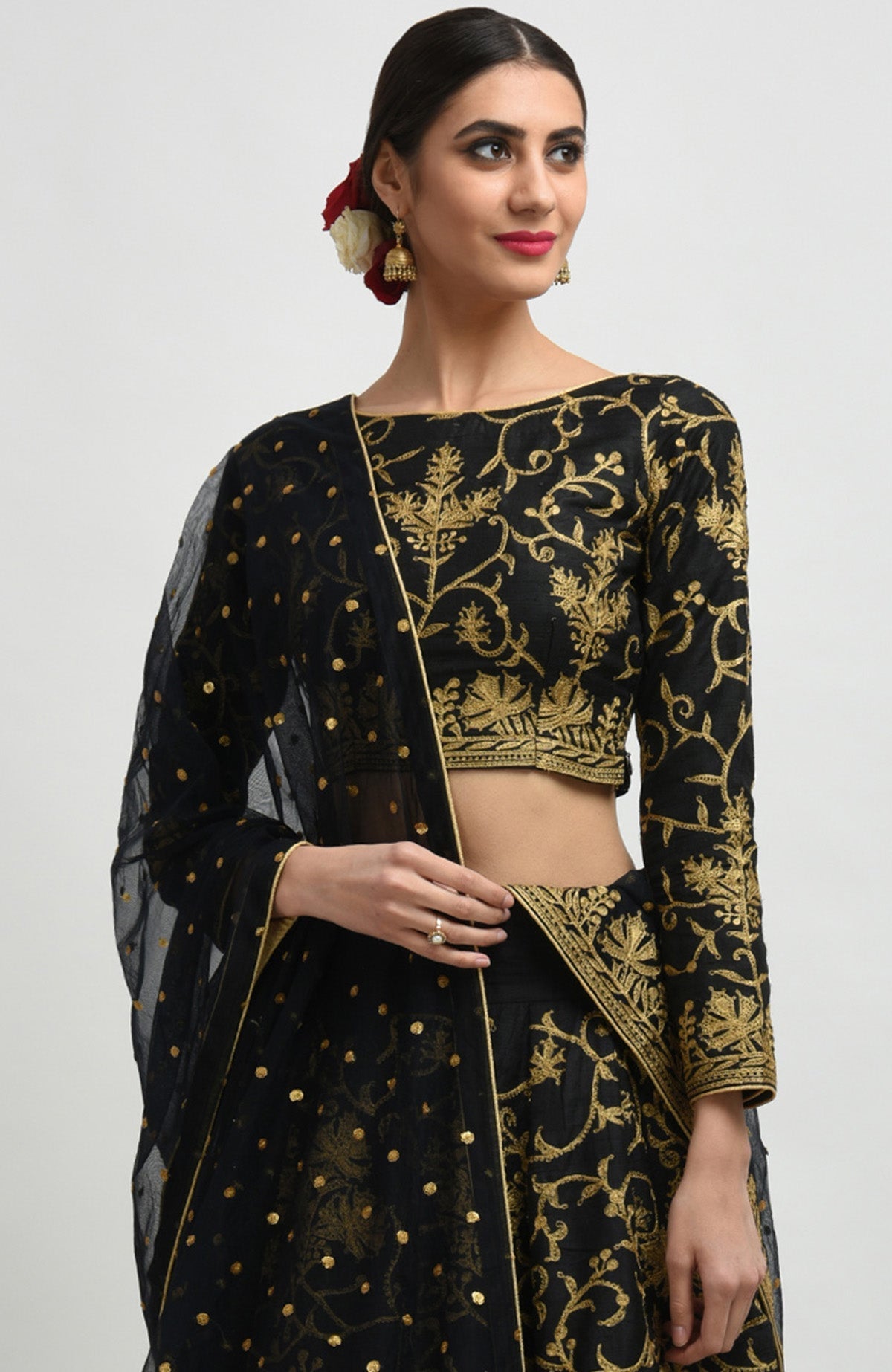Black raw silk lehenga set with gold Kashmiri tilla aari embroidery and net dupatta.