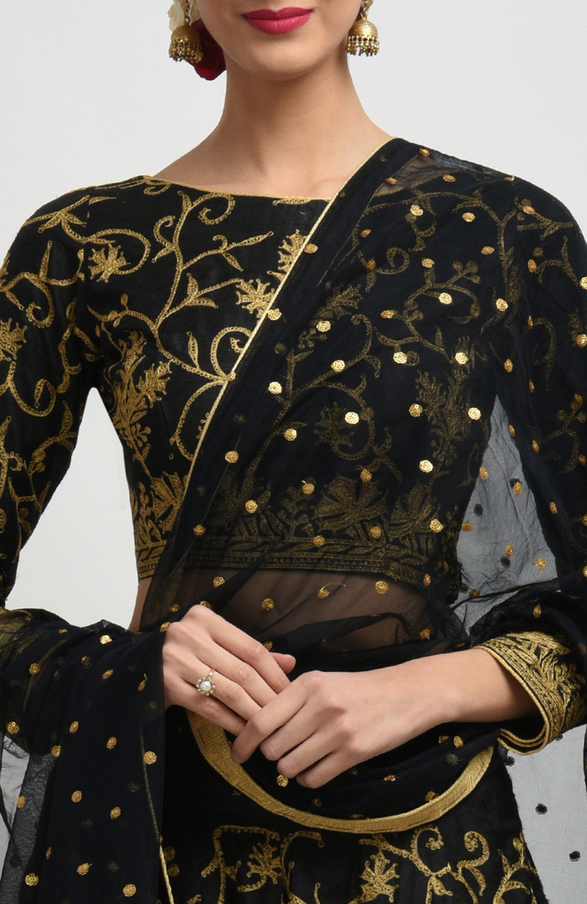 Black raw silk lehenga set with gold Kashmiri tilla aari embroidery and net dupatta.