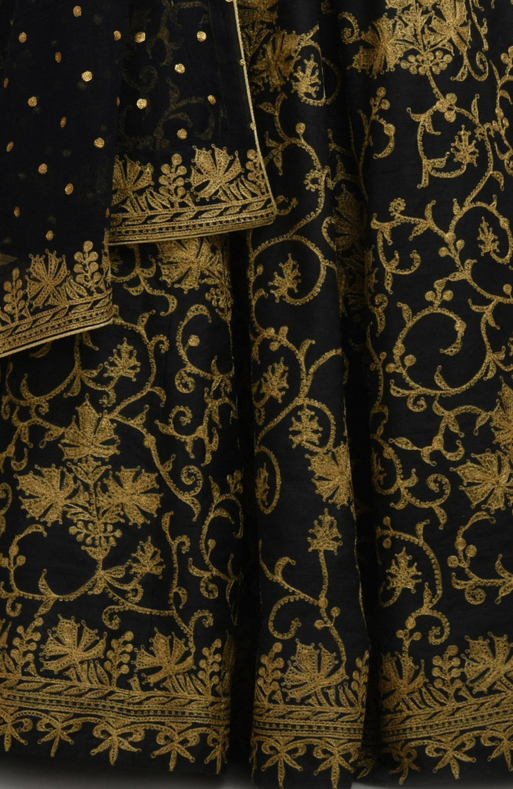 Black raw silk lehenga set with gold Kashmiri tilla aari embroidery and net dupatta.