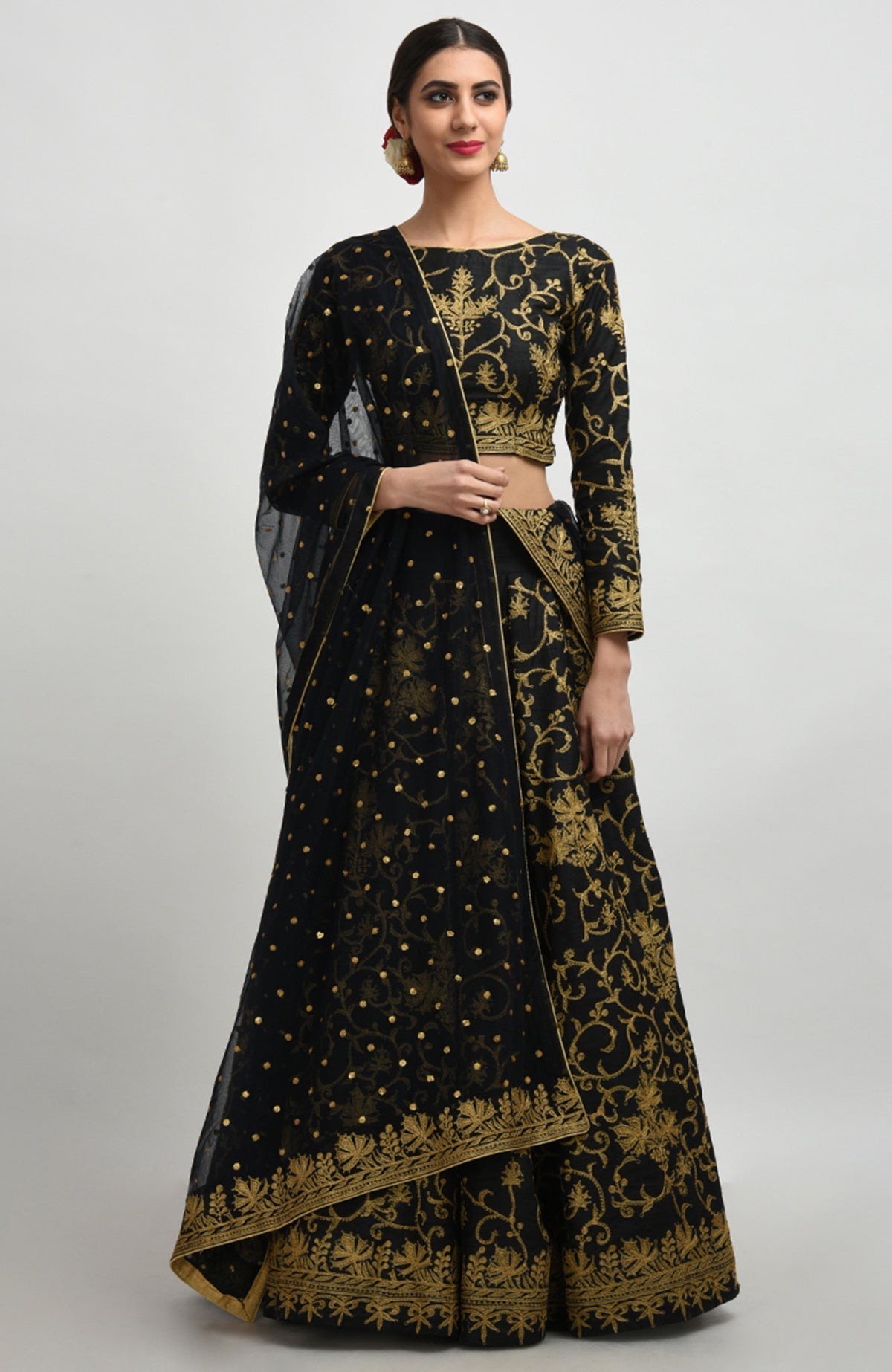 Black raw silk lehenga set with gold Kashmiri tilla aari embroidery and net dupatta.