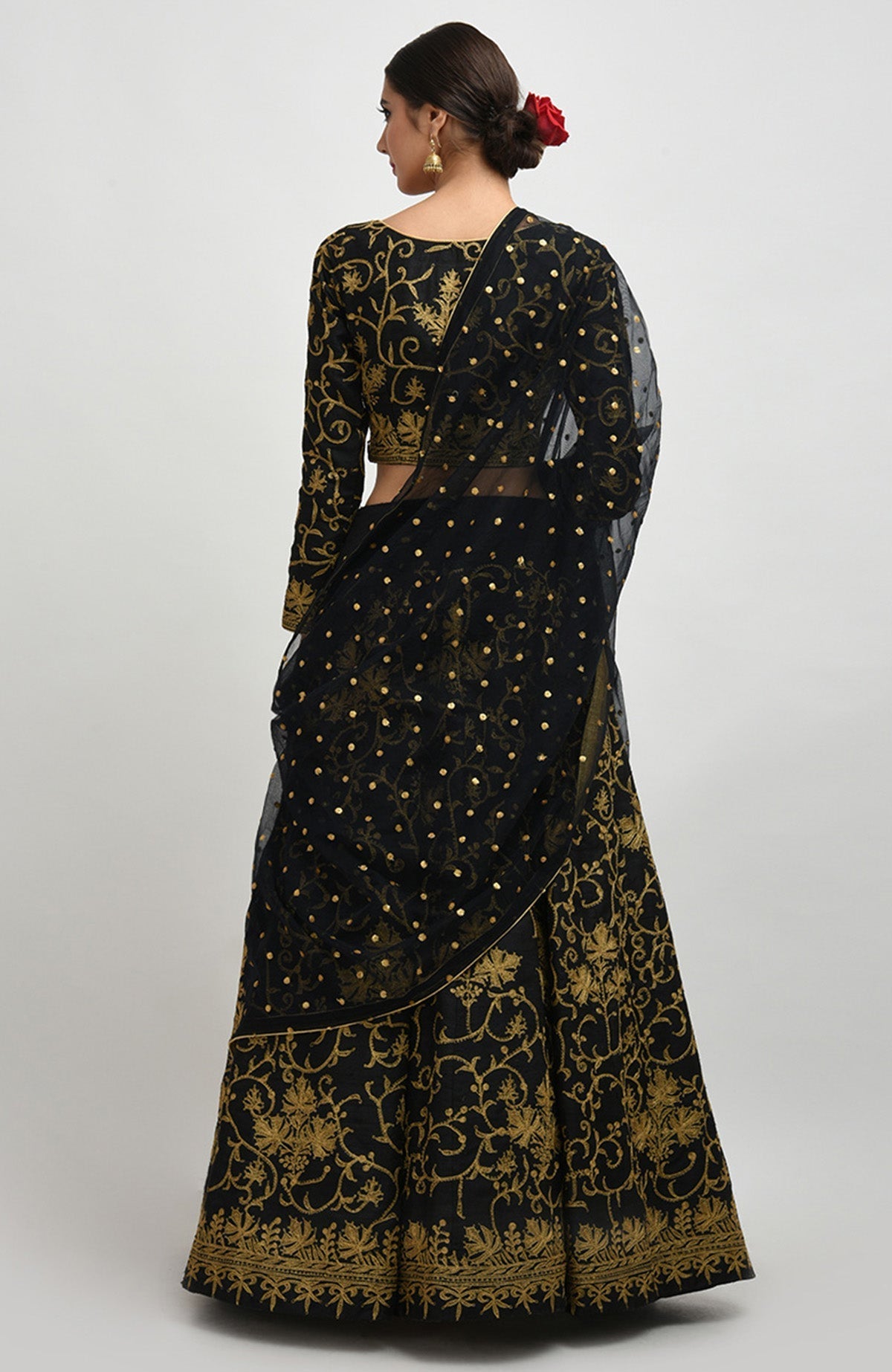 Black raw silk lehenga set with gold Kashmiri tilla aari embroidery and net dupatta.
