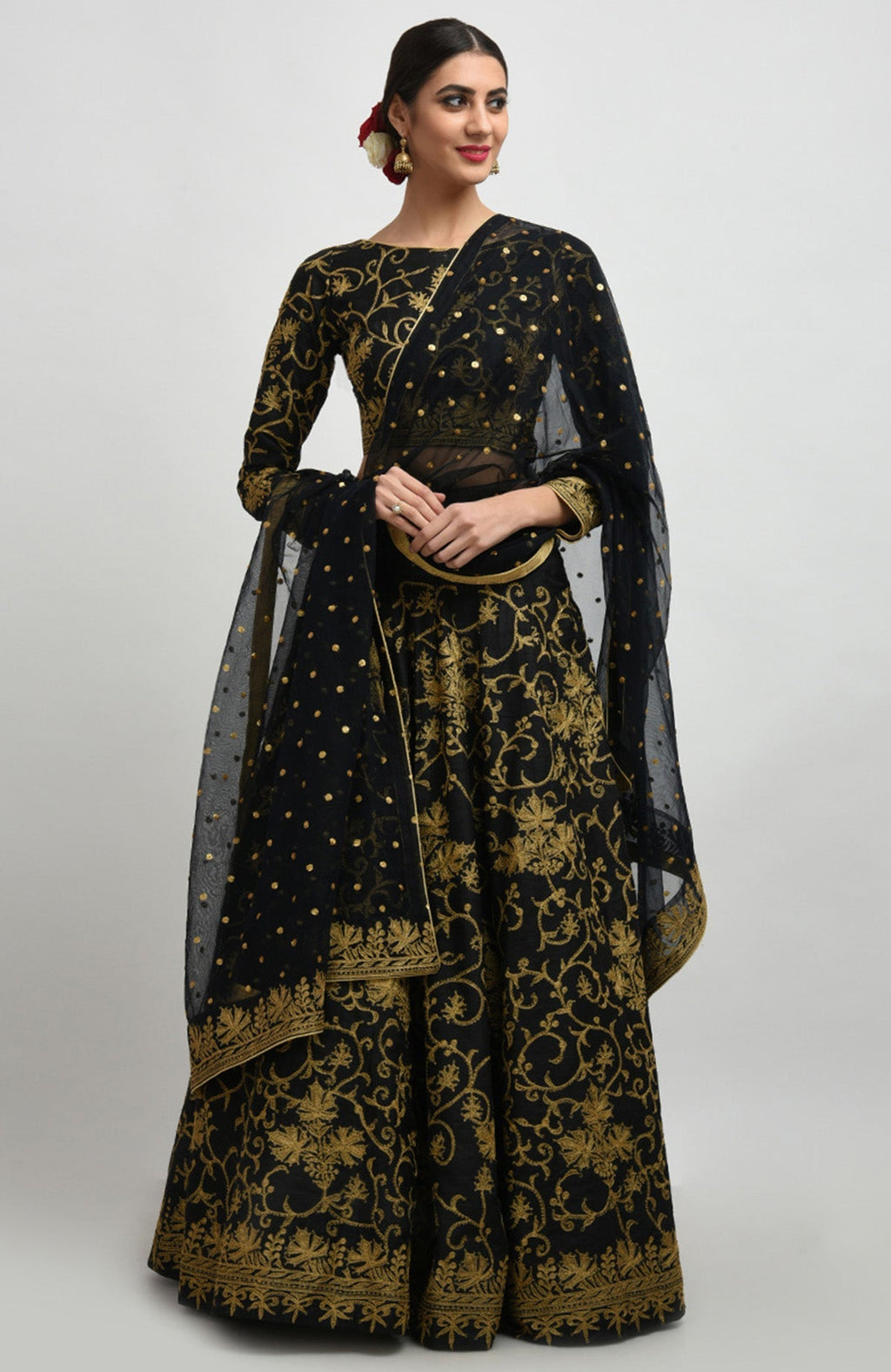 Black raw silk lehenga set with gold Kashmiri tilla aari embroidery and net dupatta.