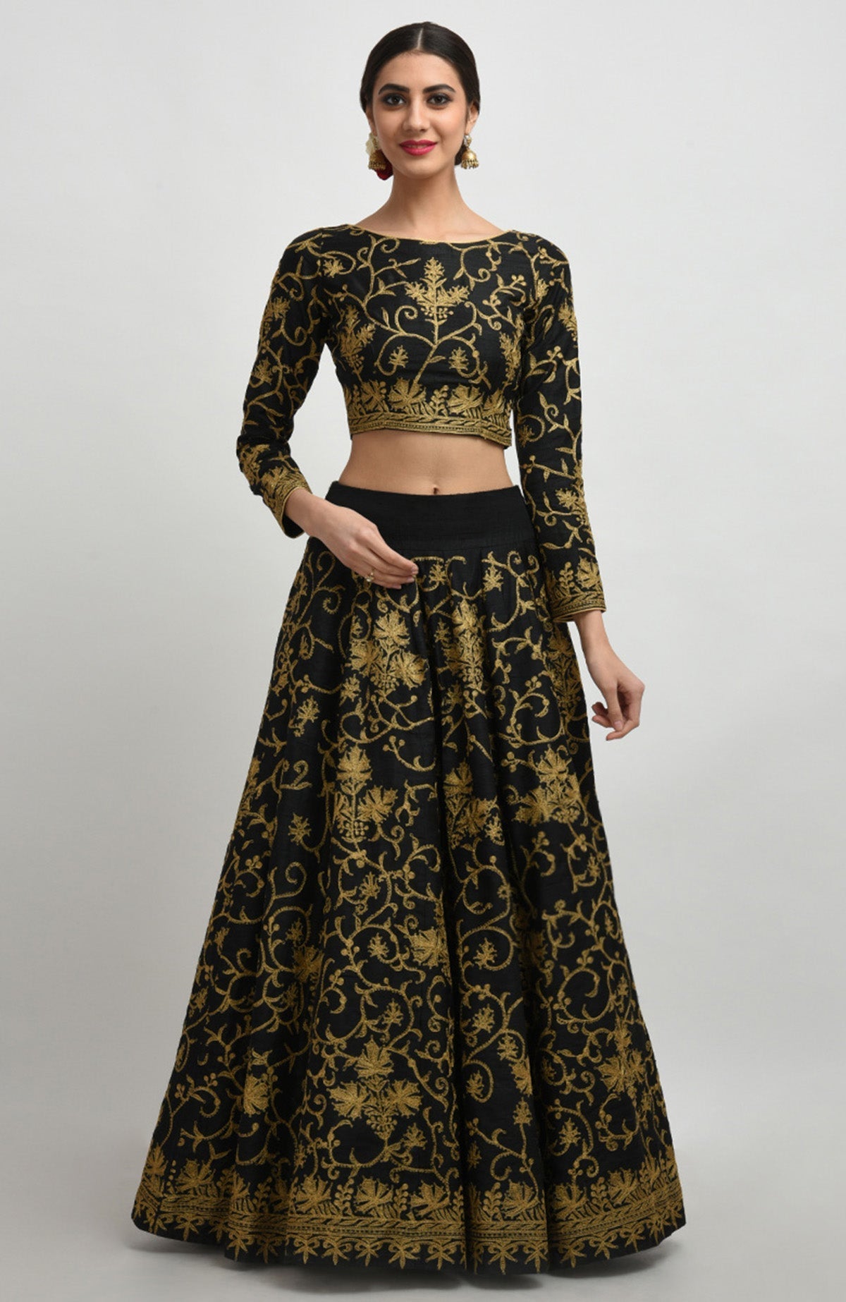 Black raw silk lehenga set with gold Kashmiri tilla aari embroidery and net dupatta.