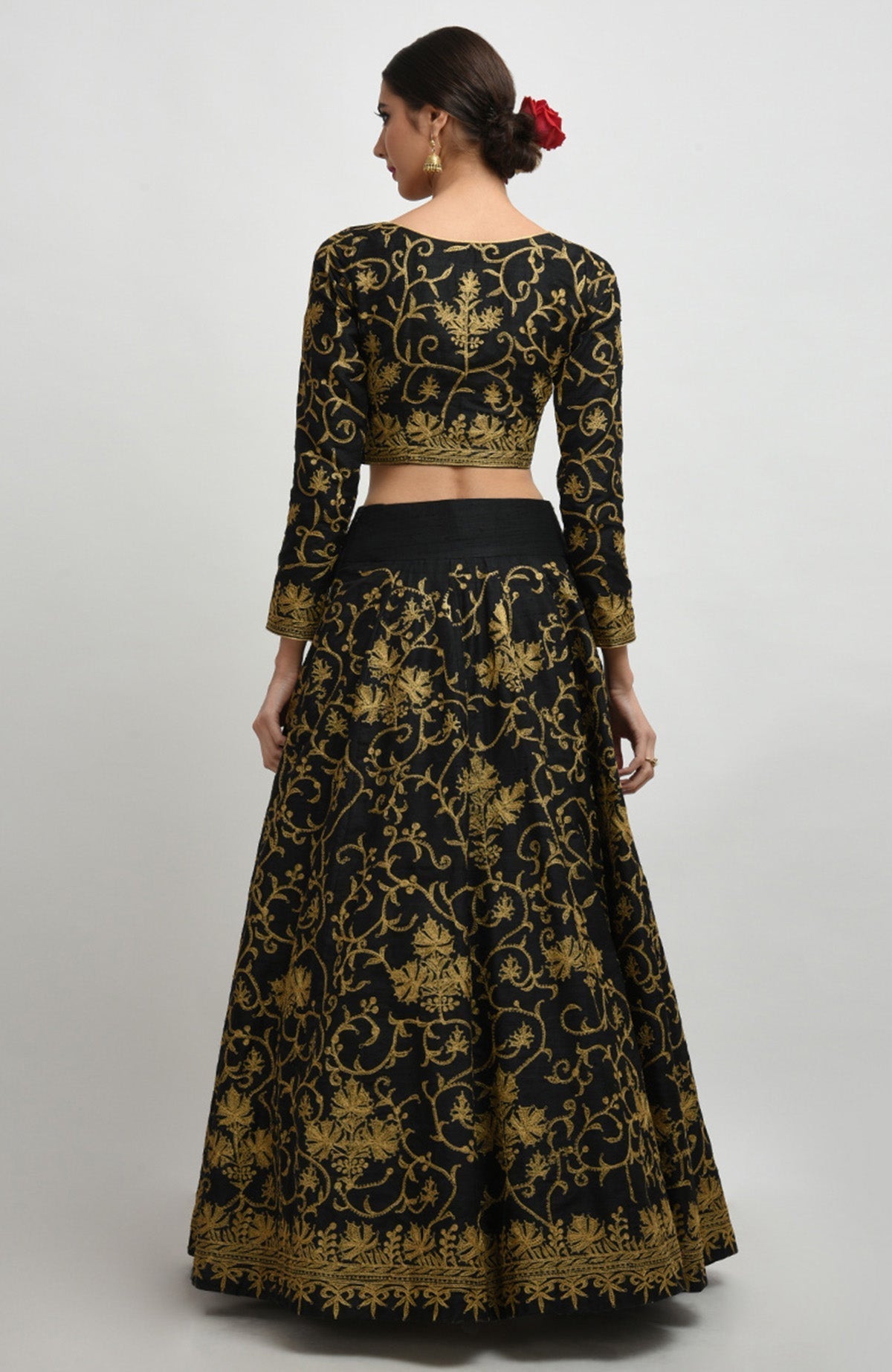 Black raw silk lehenga set with gold Kashmiri tilla aari embroidery and net dupatta.