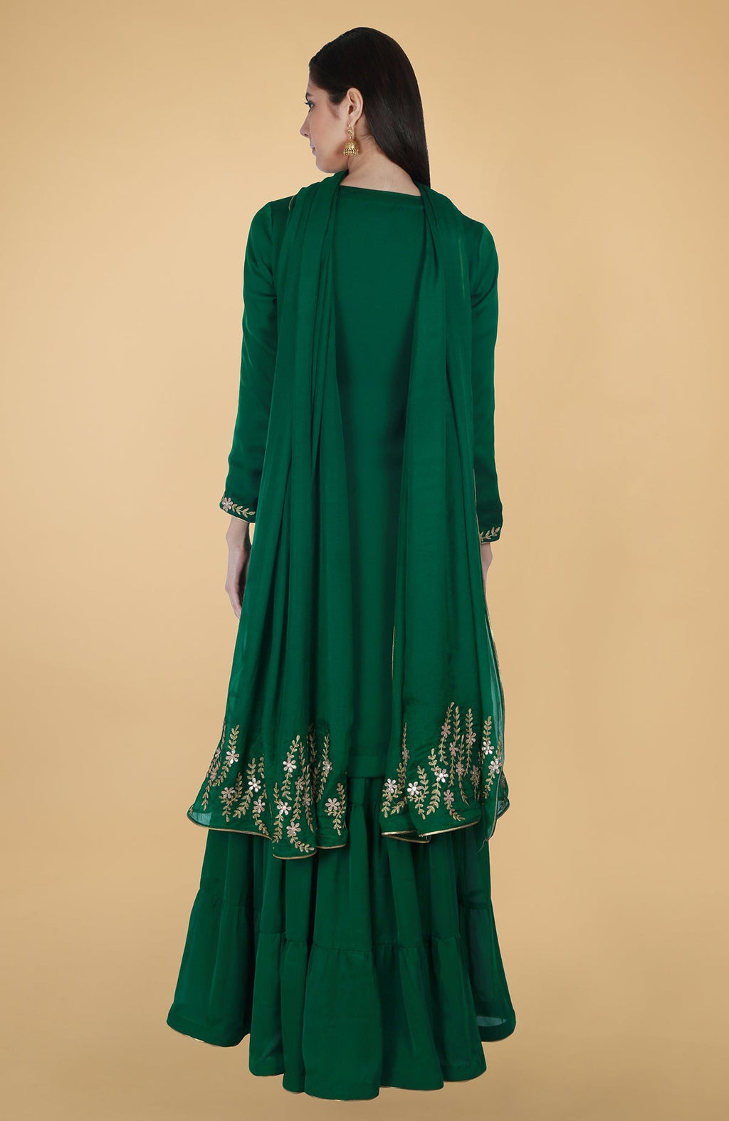 Emerald green satin chiffon gharara suit with gold gota patti floral embroidery and piping details