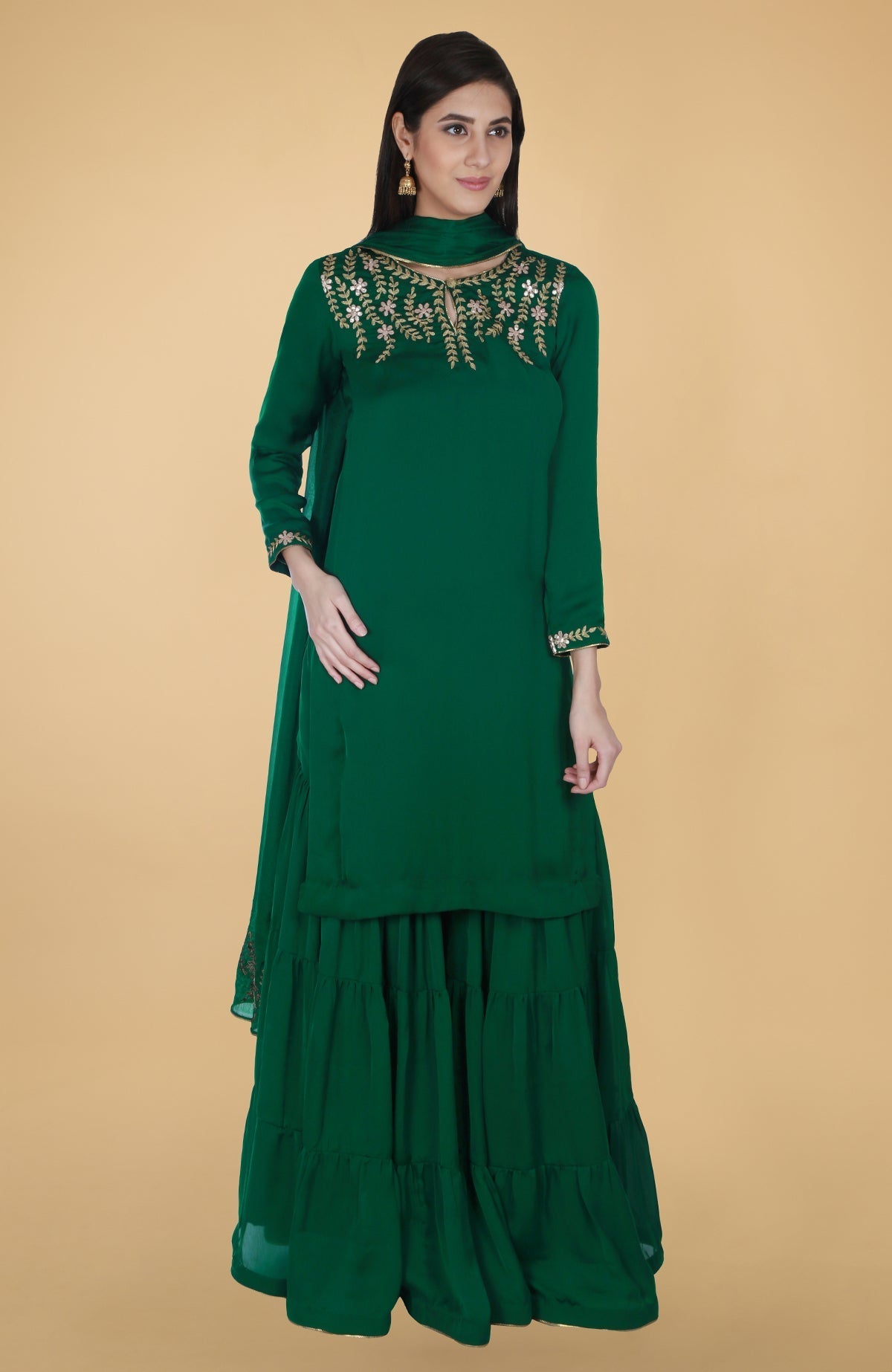 Emerald green satin chiffon gharara suit with gold gota patti floral embroidery and piping details