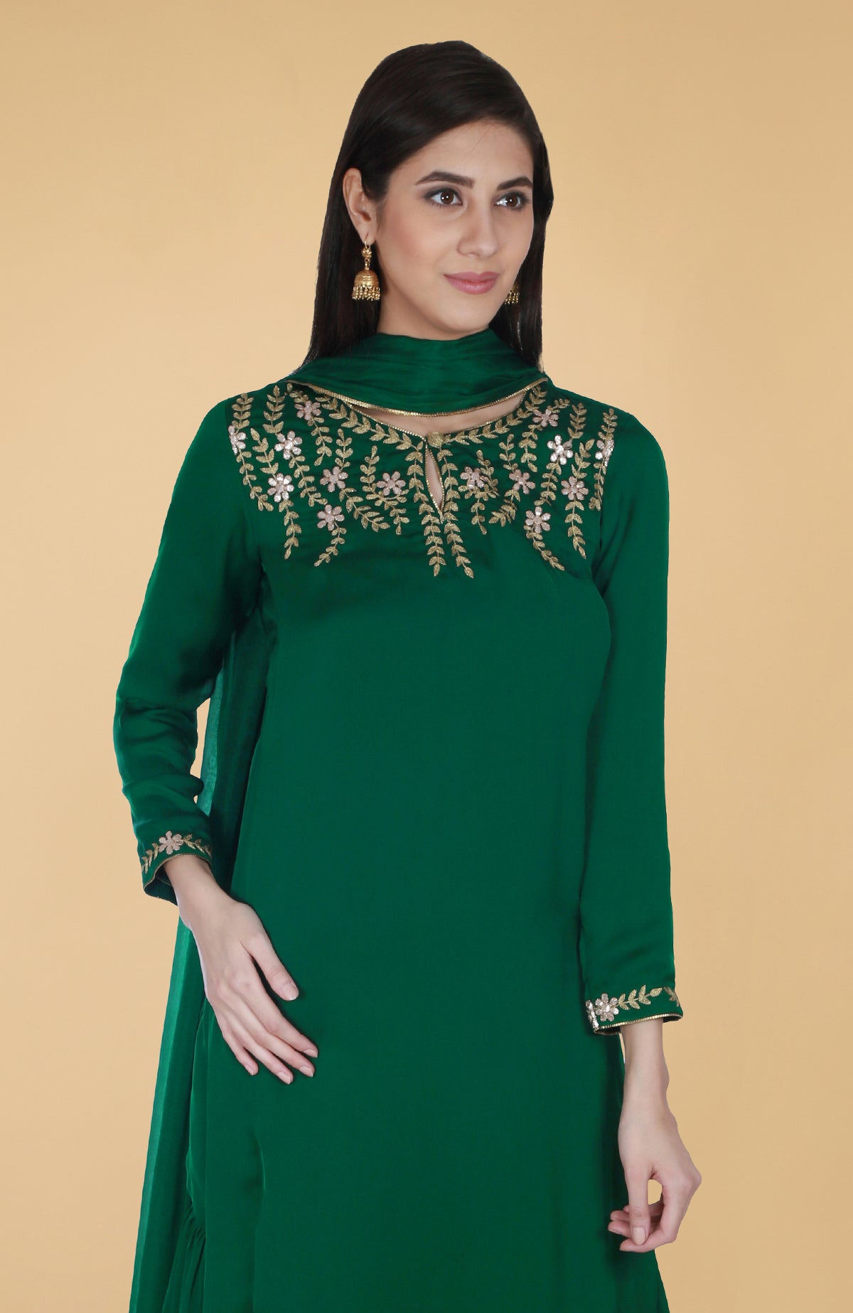 Emerald green satin chiffon gharara suit with gold gota patti floral embroidery and piping details