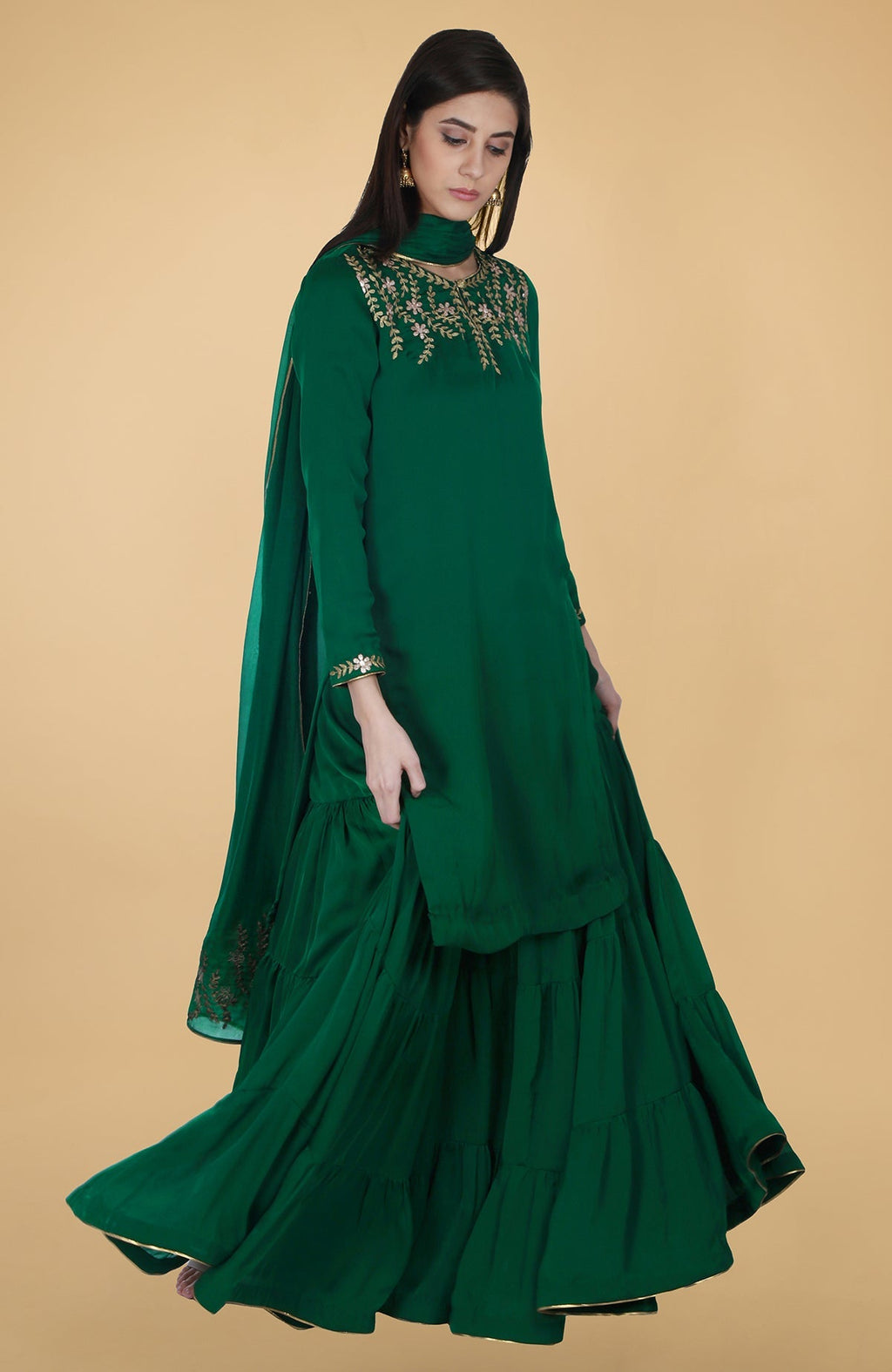 Emerald green satin chiffon gharara suit with gold gota patti floral embroidery and piping details