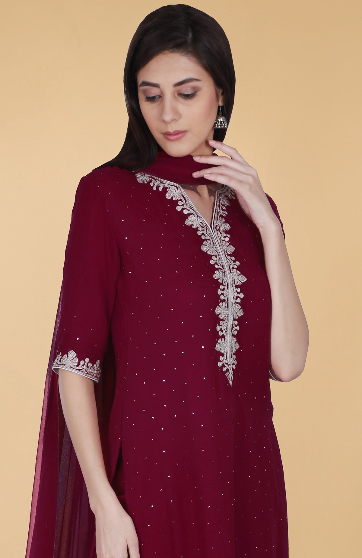 Burgundy georgette gharara suit with silver tilla and mukaish embroidery and straight cut kurta