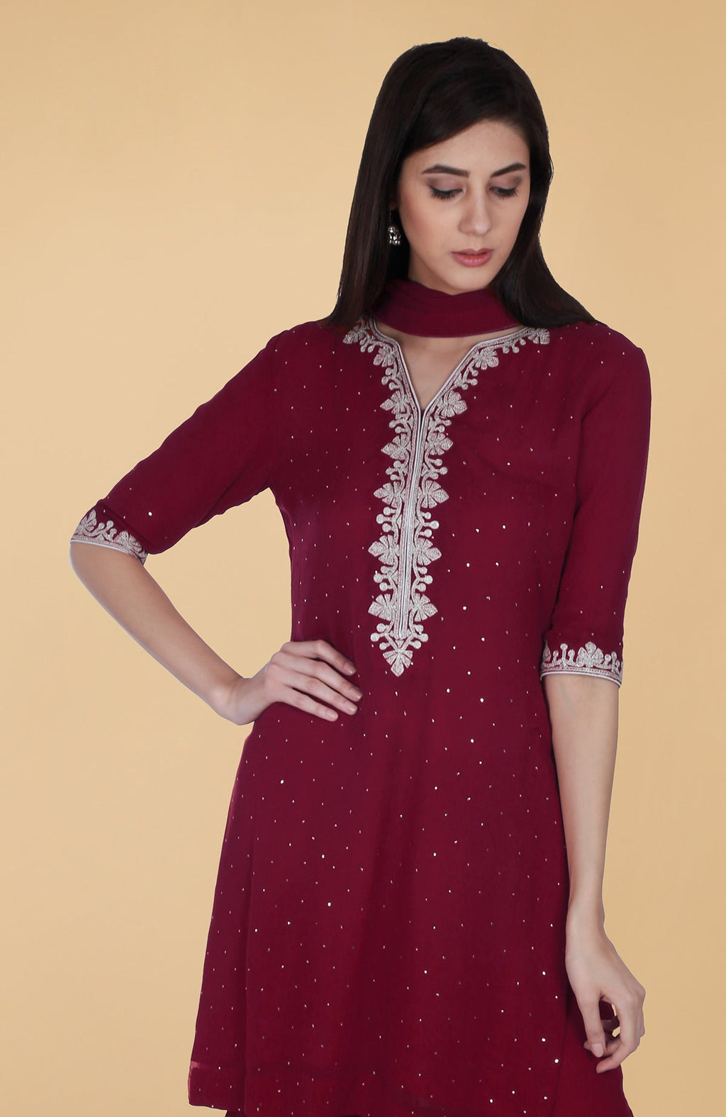 Burgundy georgette gharara suit with silver tilla and mukaish embroidery and straight kurta