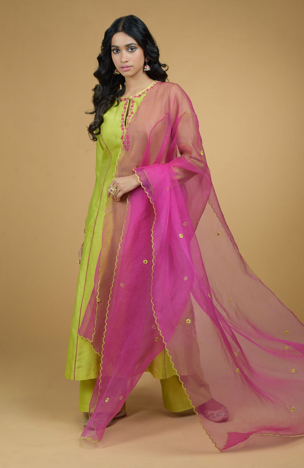 Lime green chanderi silk kurta with magenta piping and floral embroidered organza dupatta.