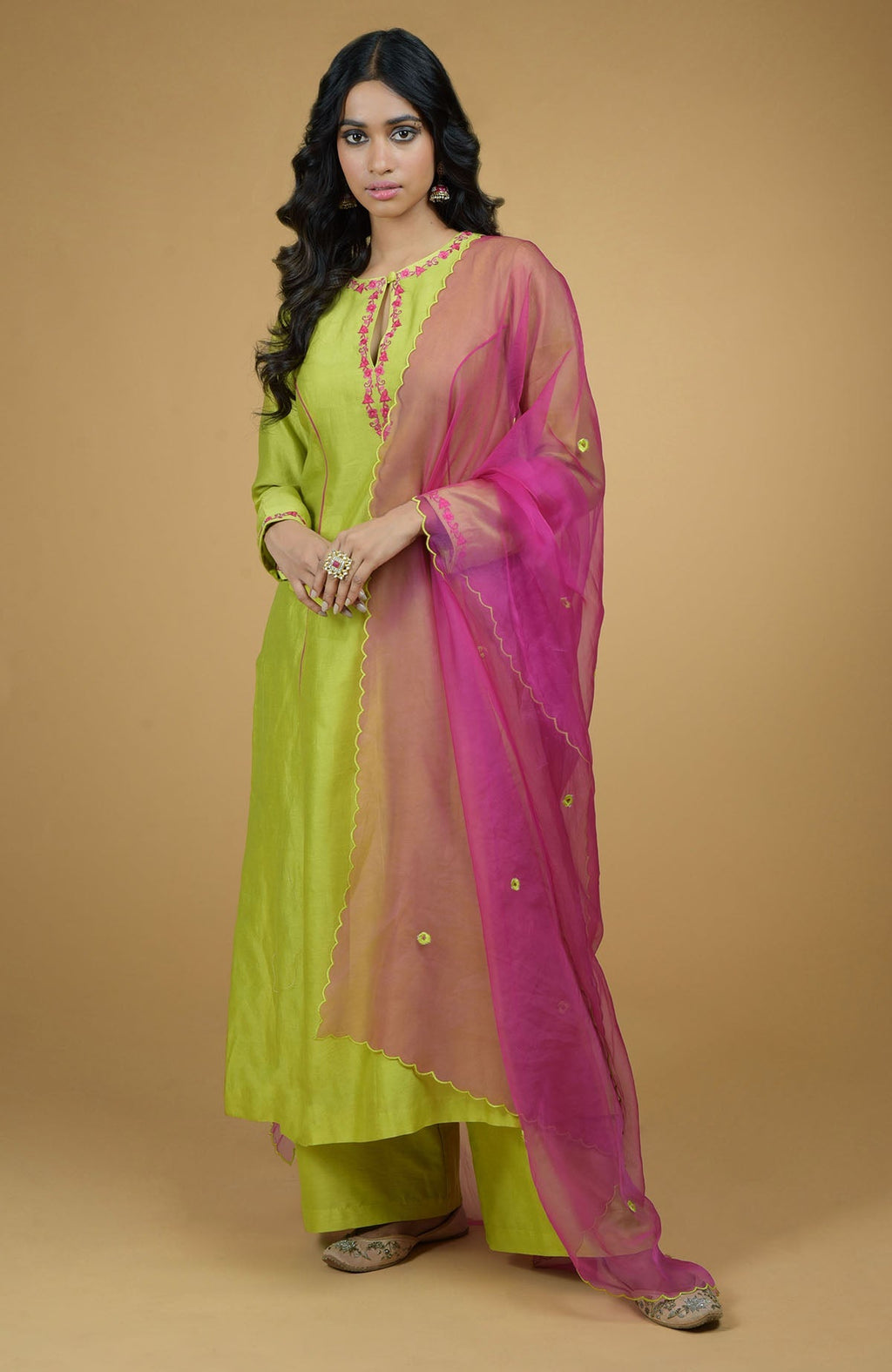 Lime green chanderi silk kurta with magenta piping and floral embroidered organza dupatta.