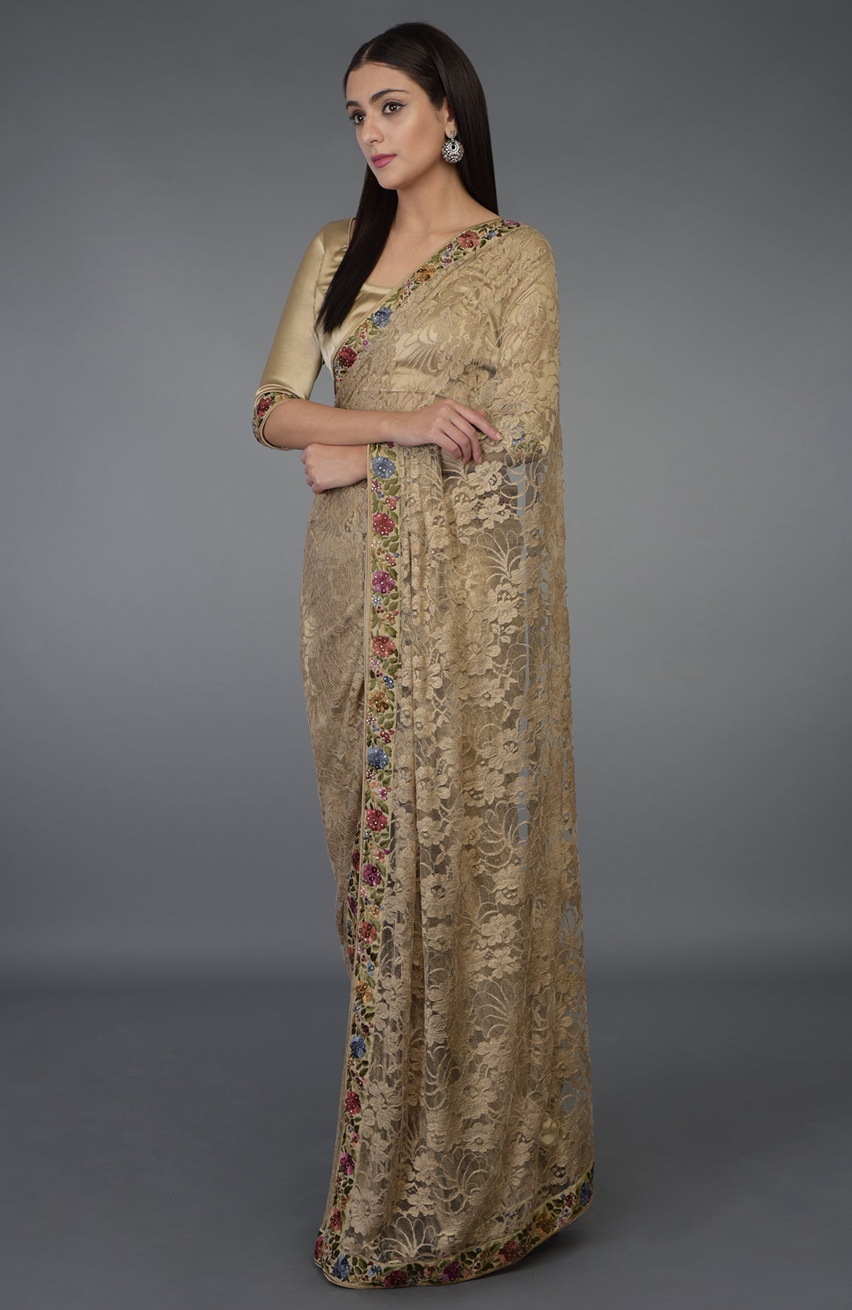 Beige French Chantilly lace saree with multicolor Parsi Gara embroidery and Swarovski crystals.