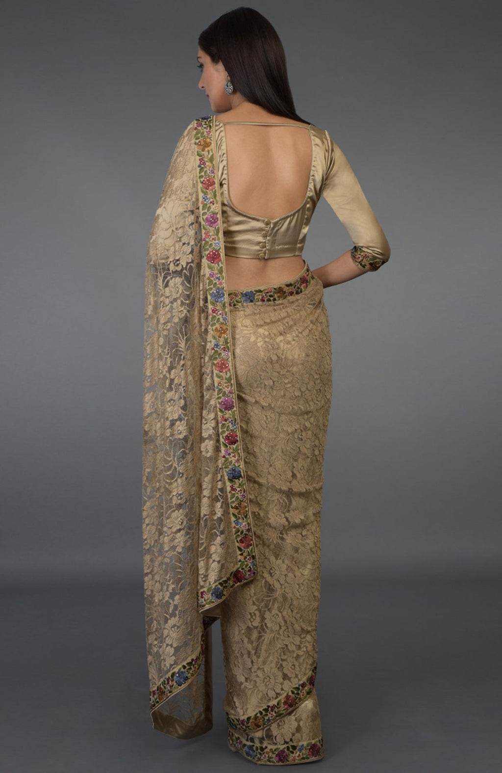 Beige French Chantilly lace saree with multicolor Parsi Gara embroidery and Swarovski crystals.
