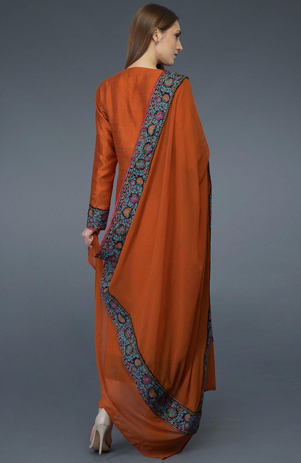 Burnt orange raw silk suit with jewel neckline and multicolor Kashmiri hand embroidery on shirt and dupatta borders