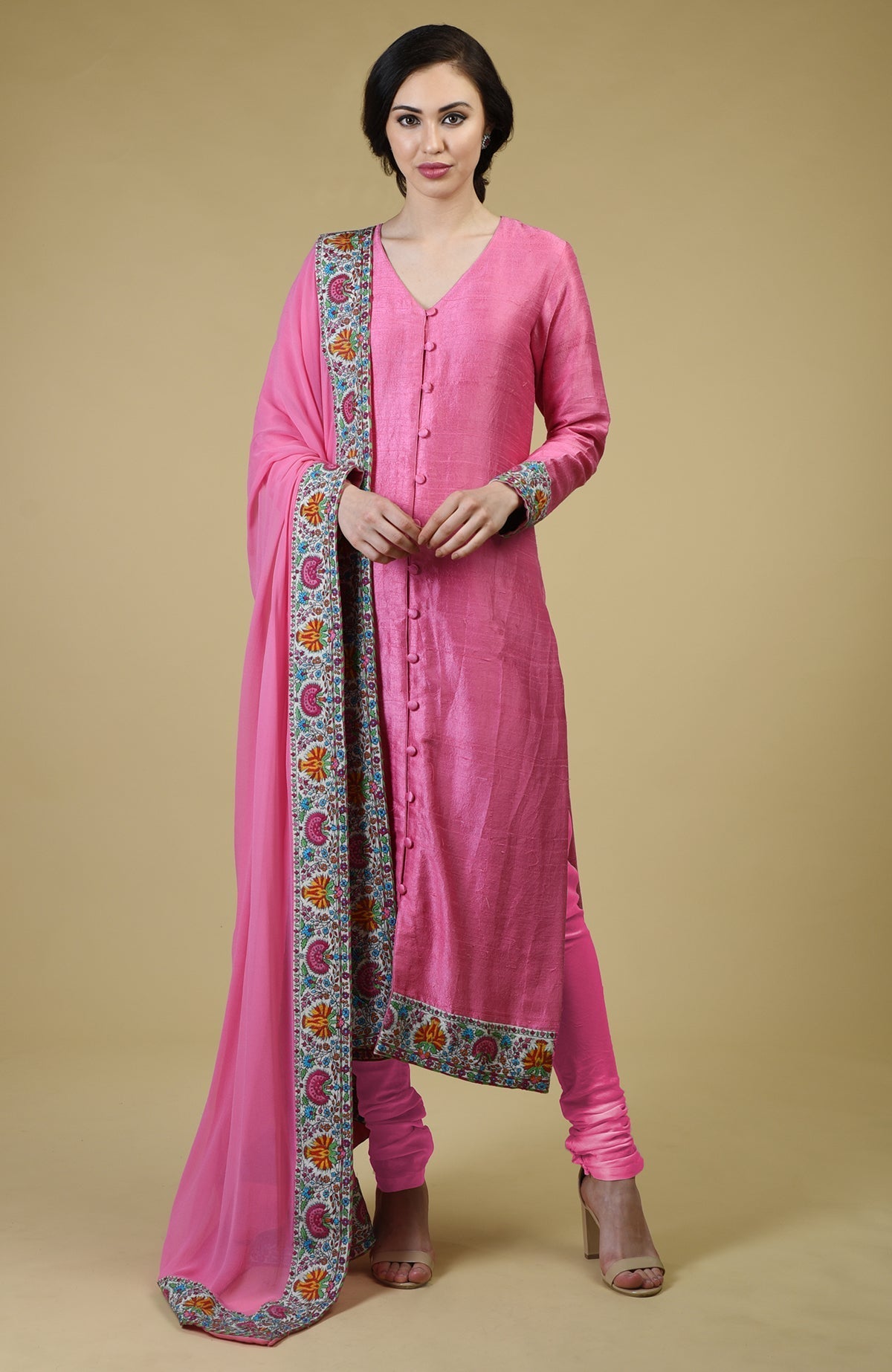 Carnation pink raw silk suit with Kashmiri hand embroidery and georgette dupatta borders.