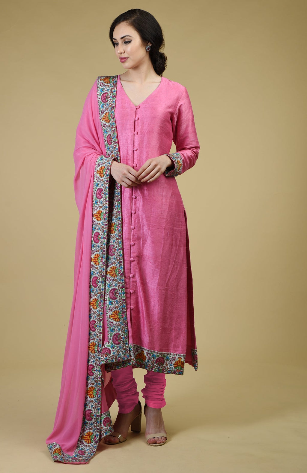 Carnation pink raw silk suit with Kashmiri hand embroidery and georgette dupatta borders.