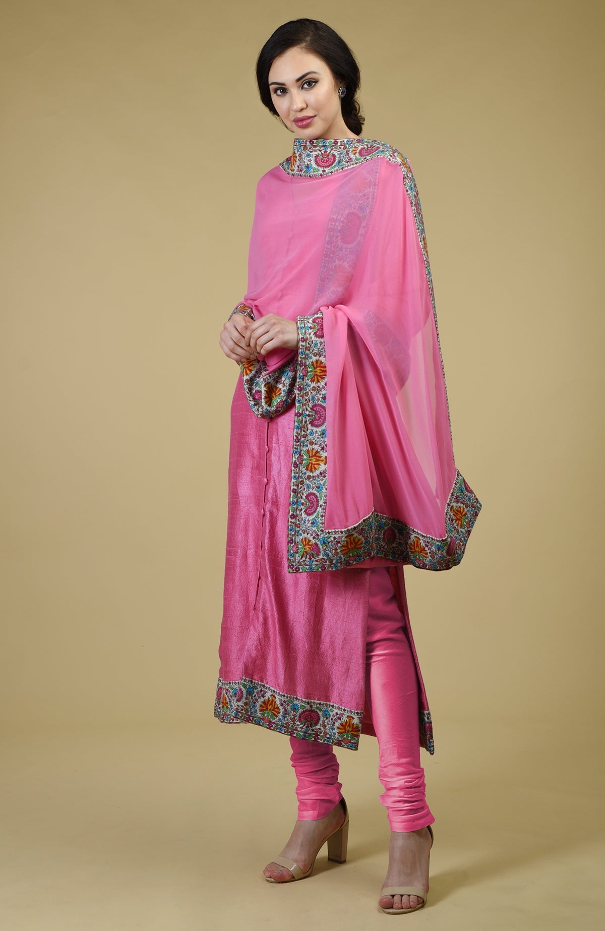 Carnation pink raw silk suit with hand embroidered Kashmiri kashidakari kurta and georgette dupatta.