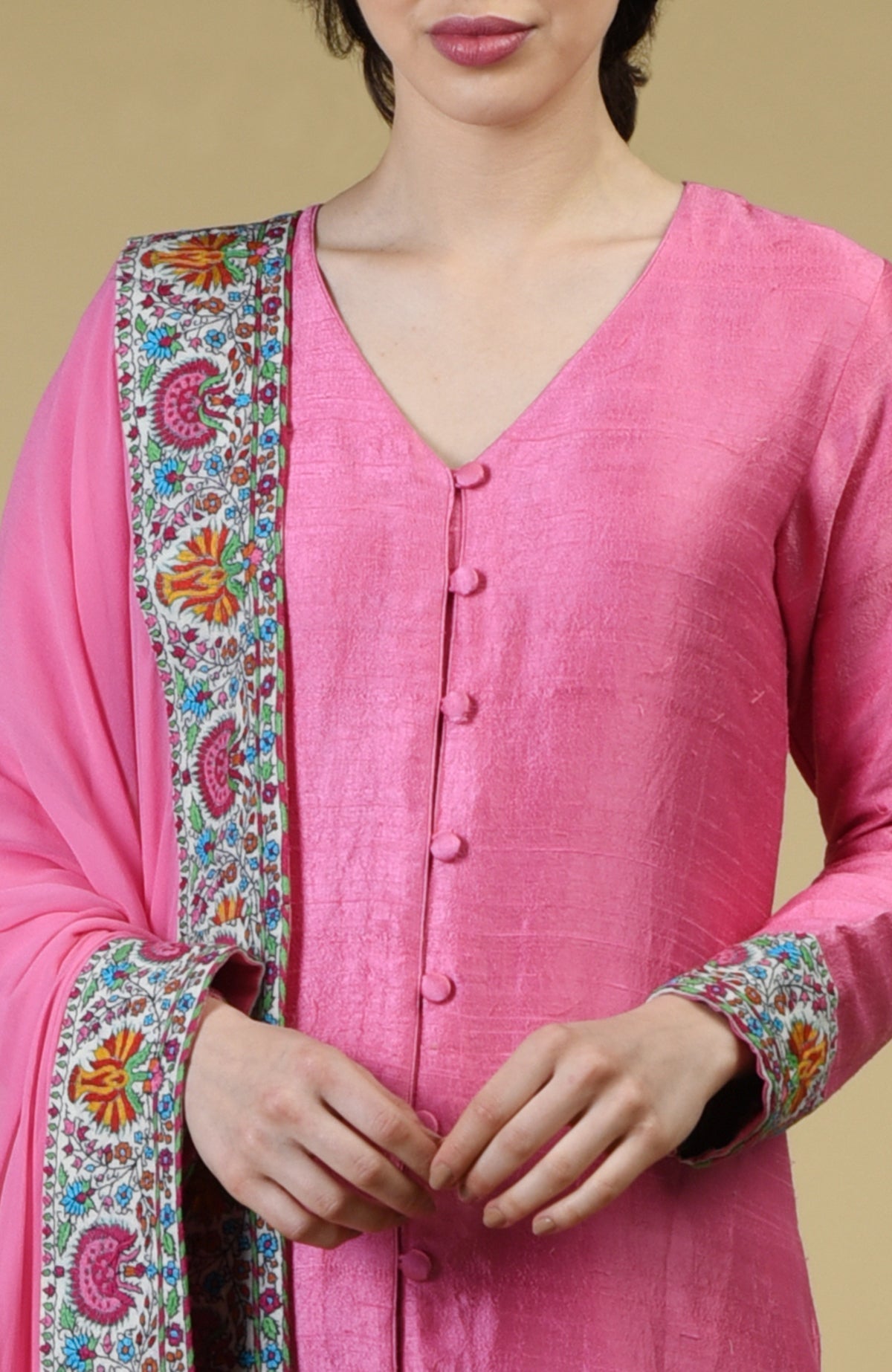 Carnation pink Kashmiri hand embroidered raw silk suit with georgette dupatta and detailed borders.