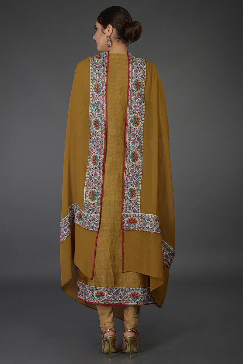 Dark mustard raw silk suit with multicolor Kashmiri hand embroidery and georgette dupatta borders.