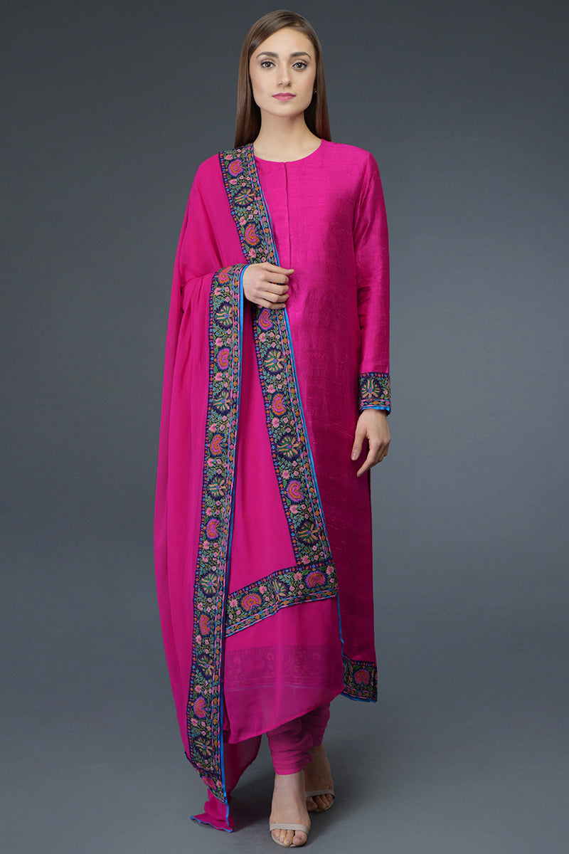 Hot pink raw silk suit with multicolor Kashmiri hand embroidery and georgette dupatta borders