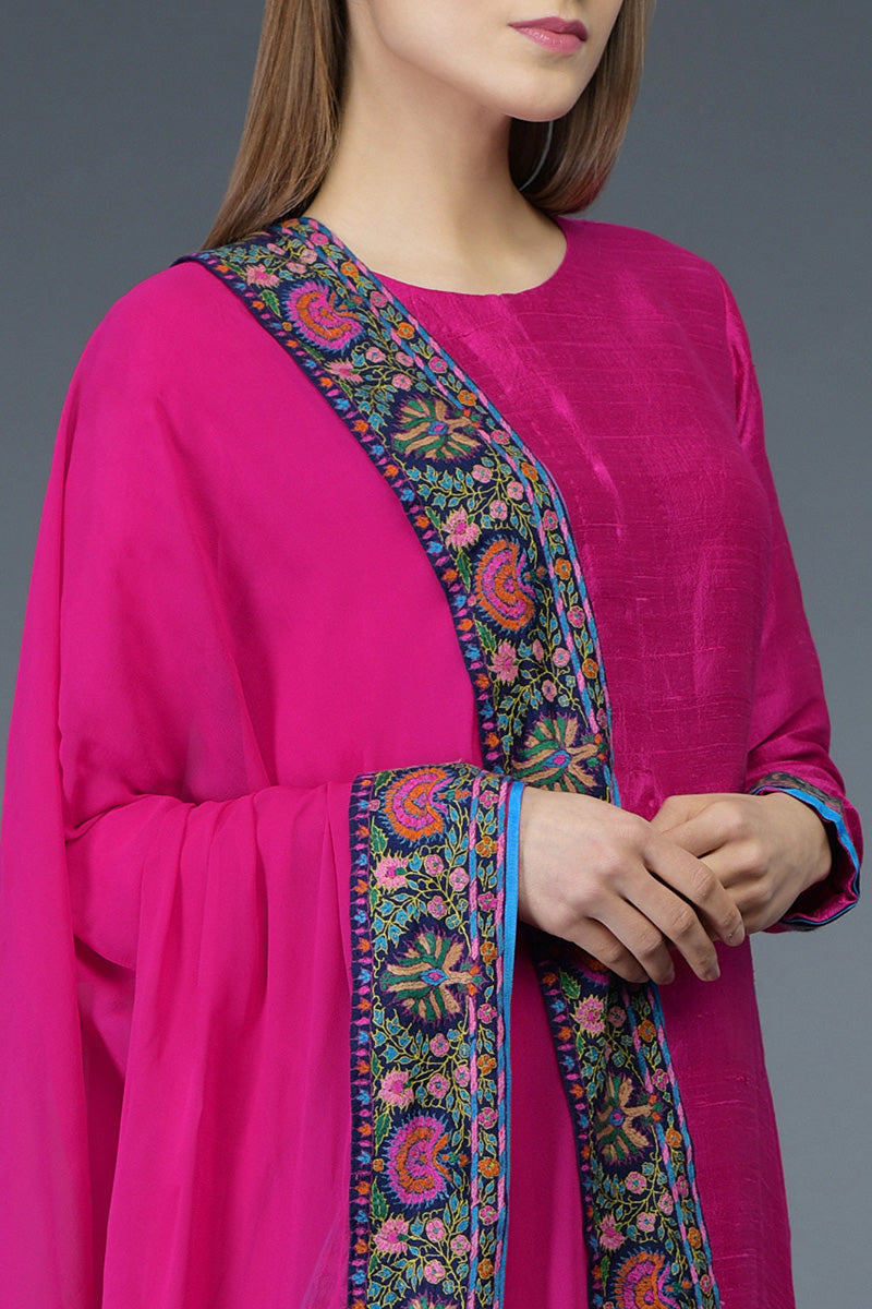 Hot pink raw silk suit with jewel neckline and multicolor Kashmiri hand embroidery on front and dupatta.