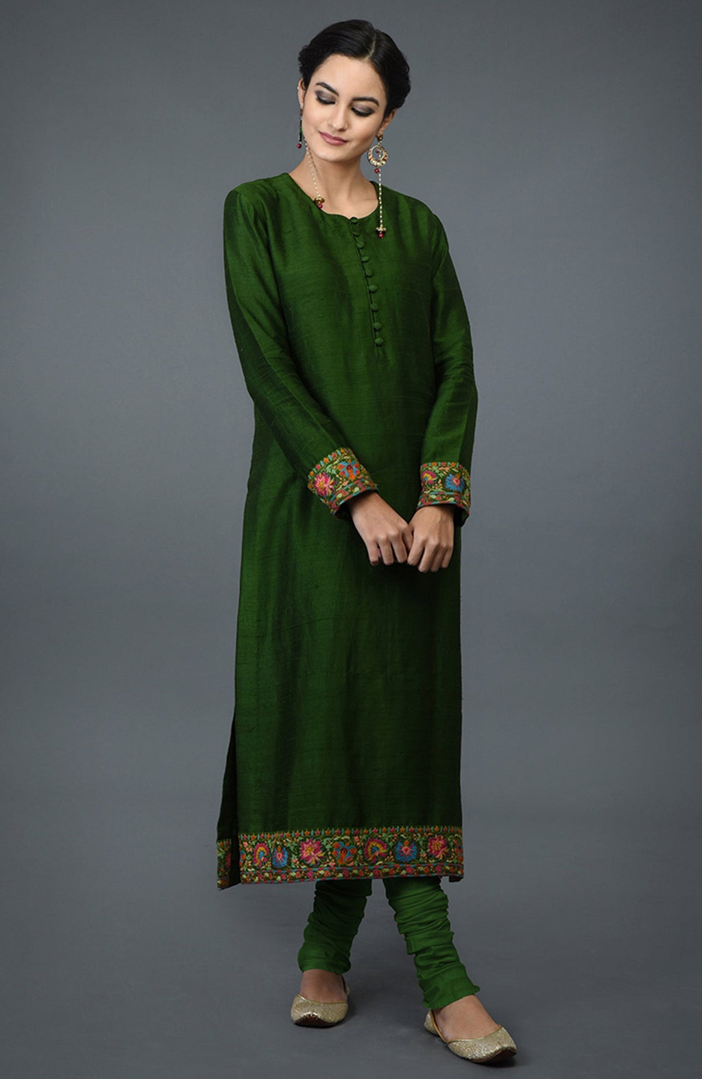 Moss green raw silk suit with colorful Kashmiri hand embroidery and georgette dupatta borders.