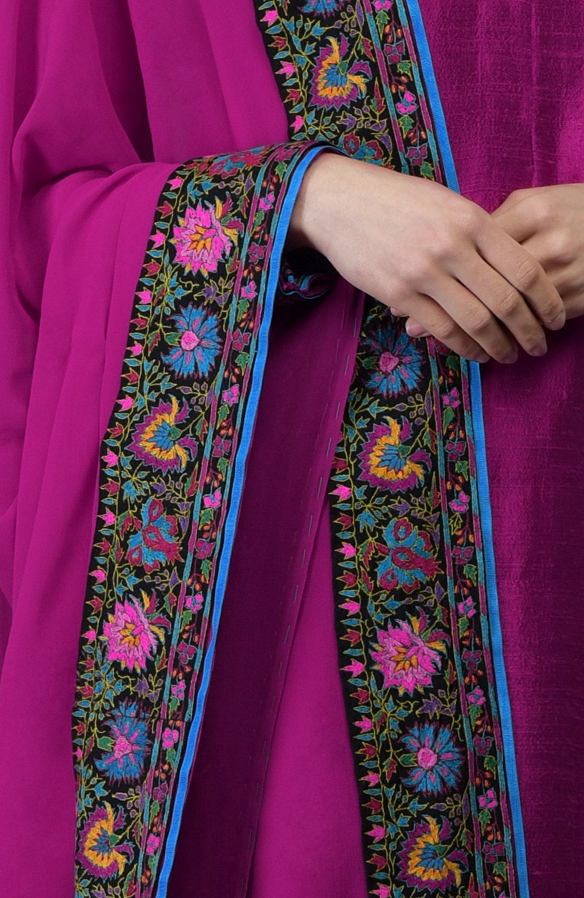 Orchid raw silk suit with multicolor Kashmiri Kashidakari embroidery and georgette dupatta borders.