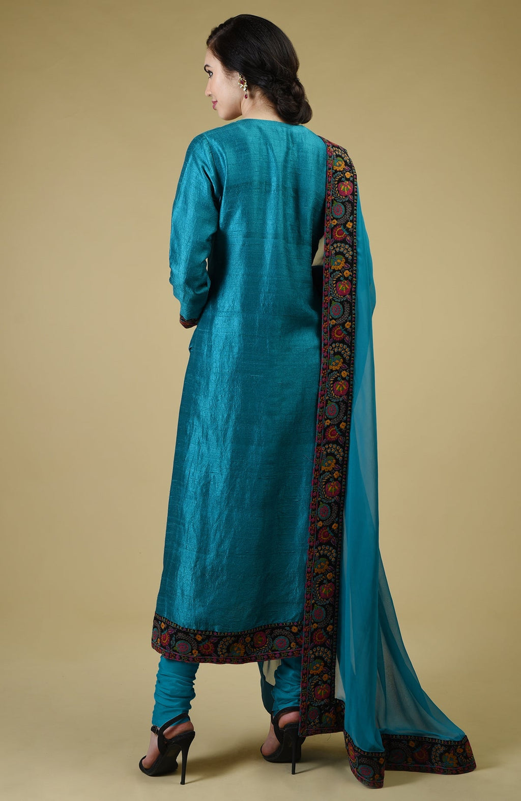 Teal blue raw silk suit with Kashmiri hand embroidery and georgette dupatta with embroidered borders