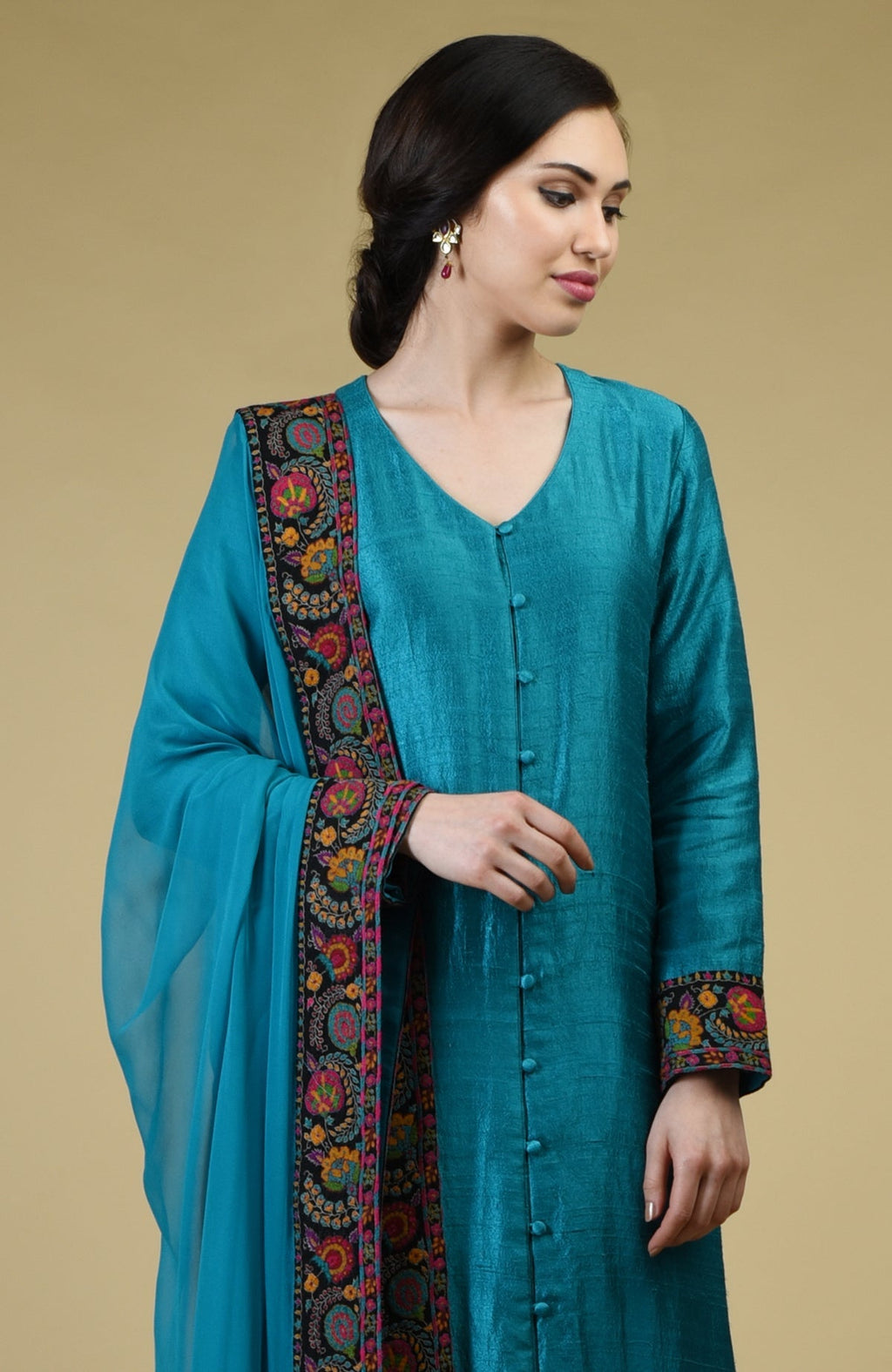 Teal blue raw silk suit with hand-embroidered Kashmiri kashidakari kurta and georgette dupatta borders