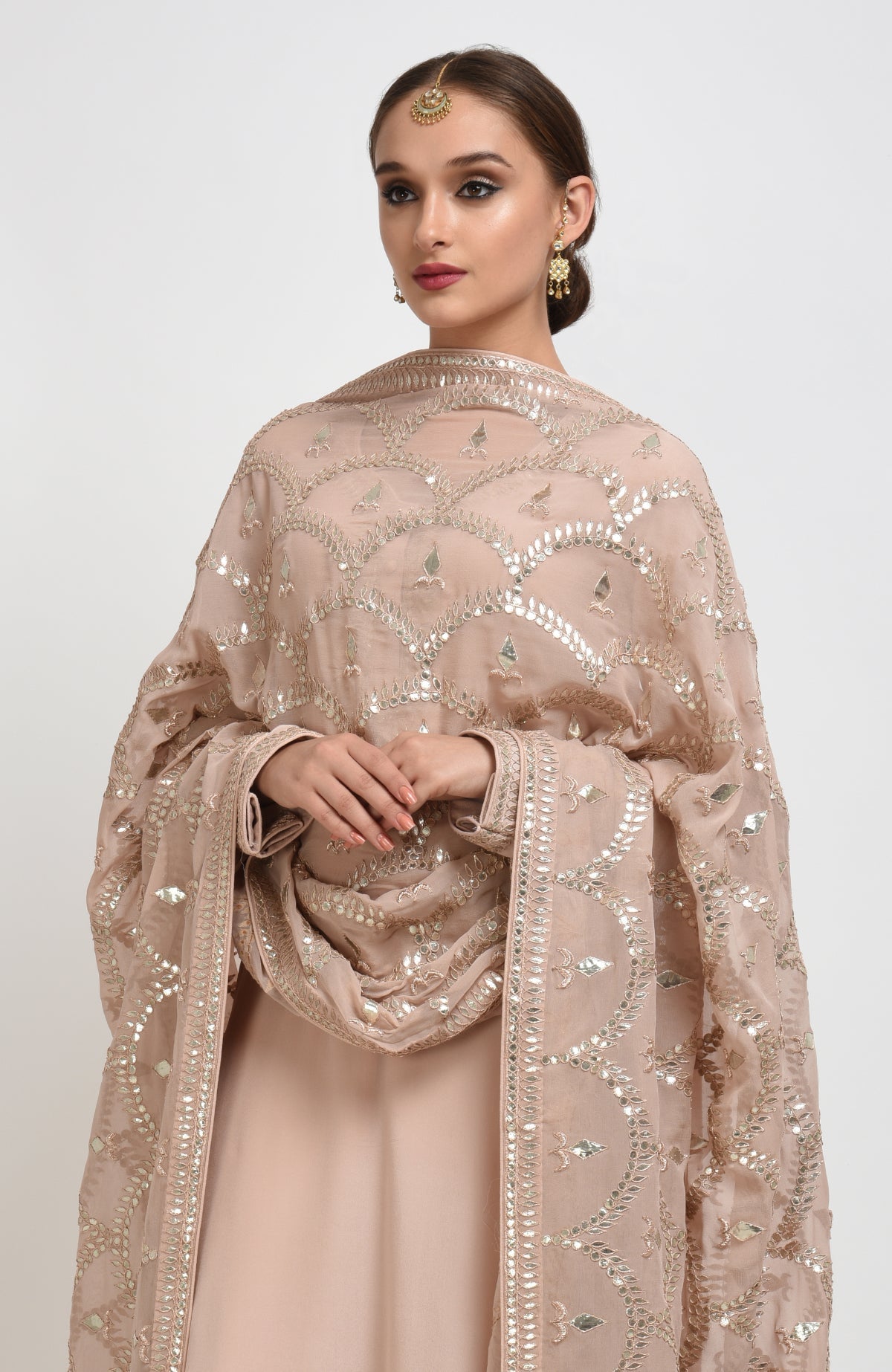 Oyster pink suit with rose gold gota patti embroidery on dupatta and shirt neckline and sleeves.