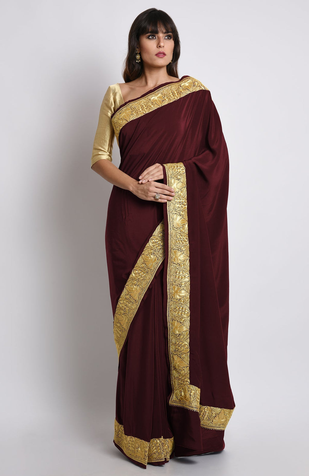 Burgundy pure crepe saree with gold Kashmiri tilla embroidery on pallav and borders