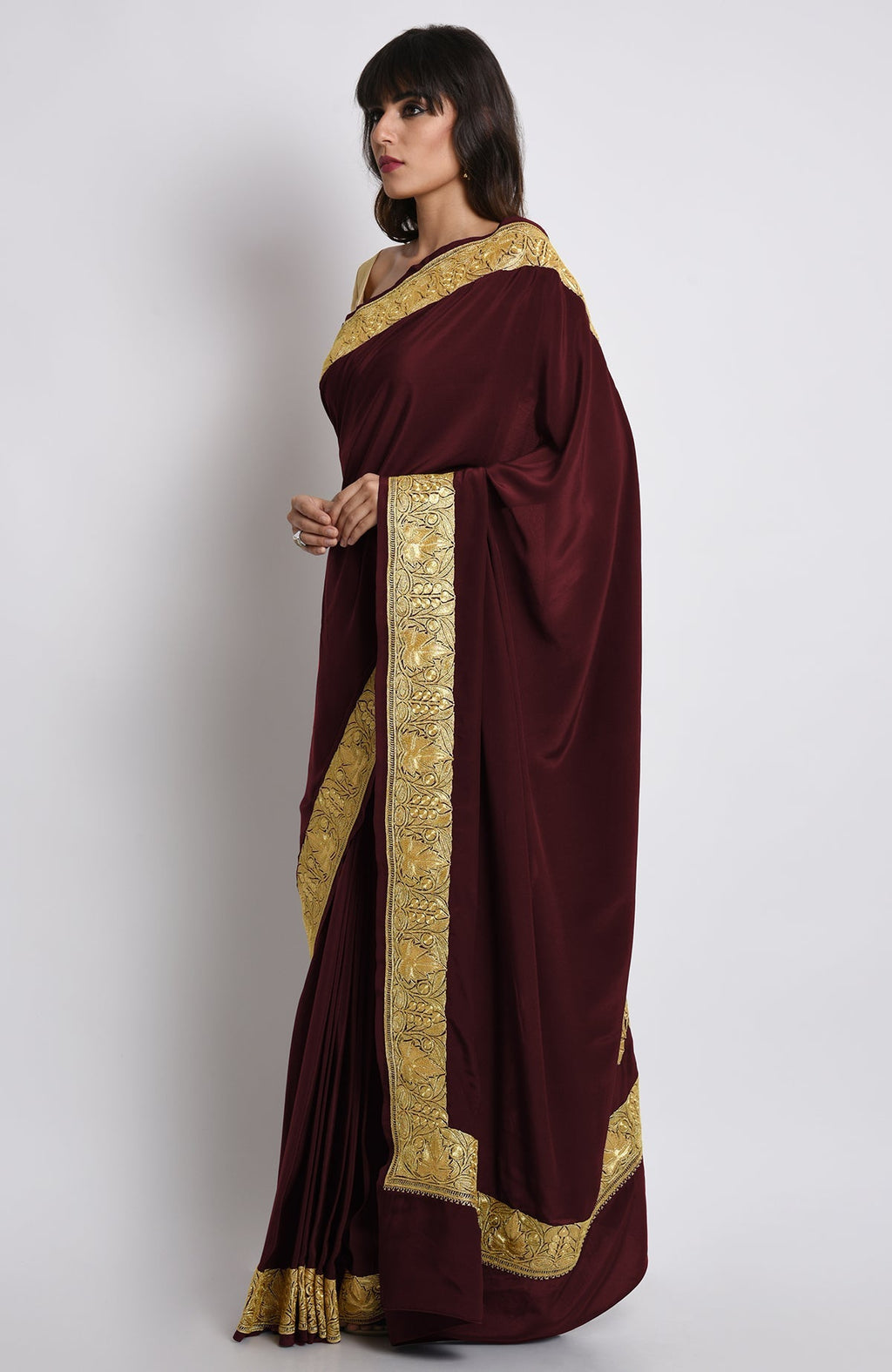 Burgundy pure crepe saree with gold Kashmiri tilla embroidery on pallav and borders