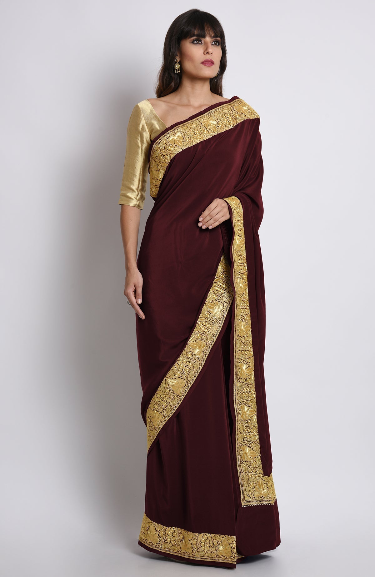 Burgundy pure crepe saree with gold Kashmiri tilla embroidery on pallav and borders