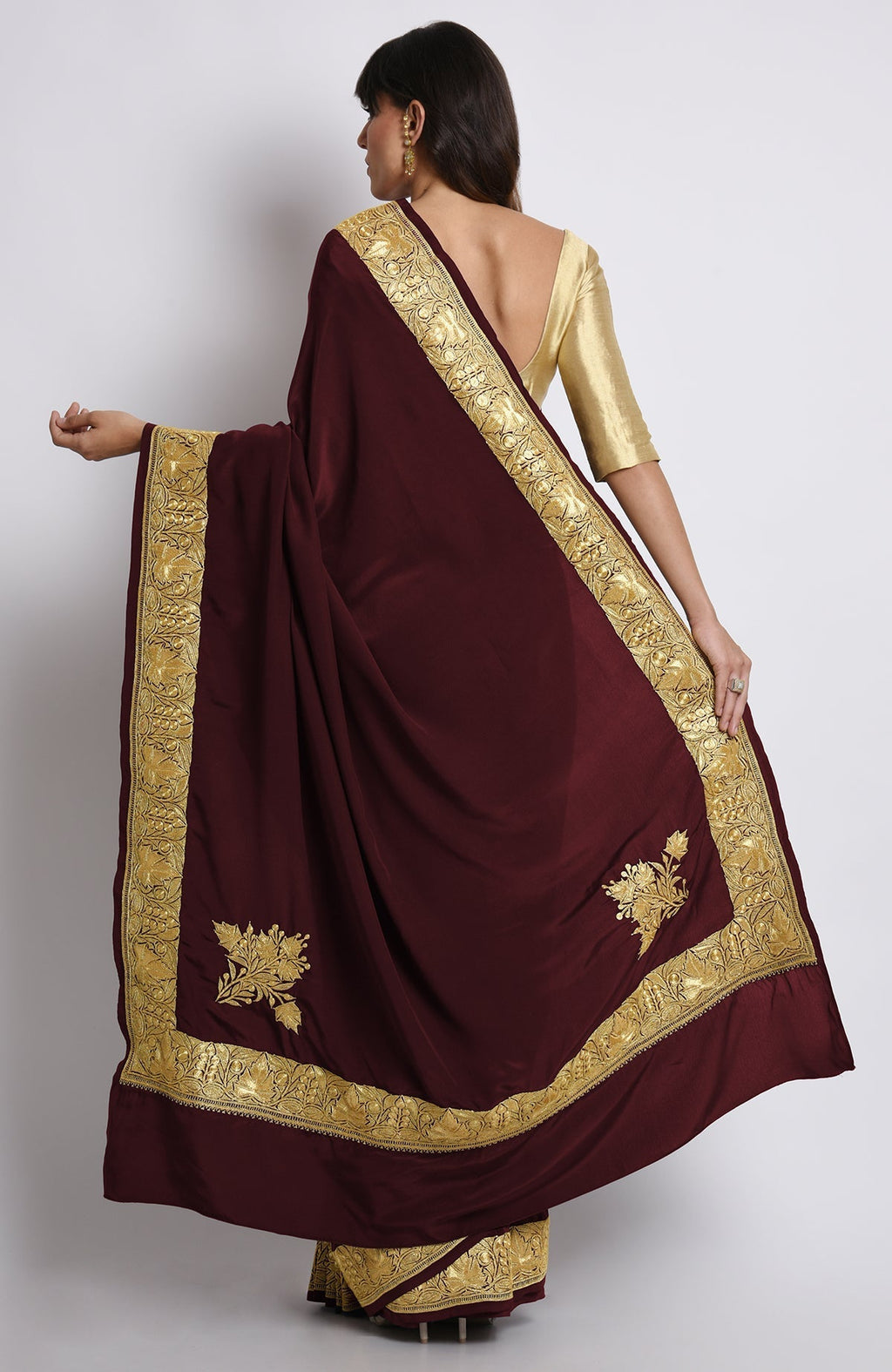 Burgundy pure crepe saree with gold Kashmiri tilla embroidery on pallav and borders