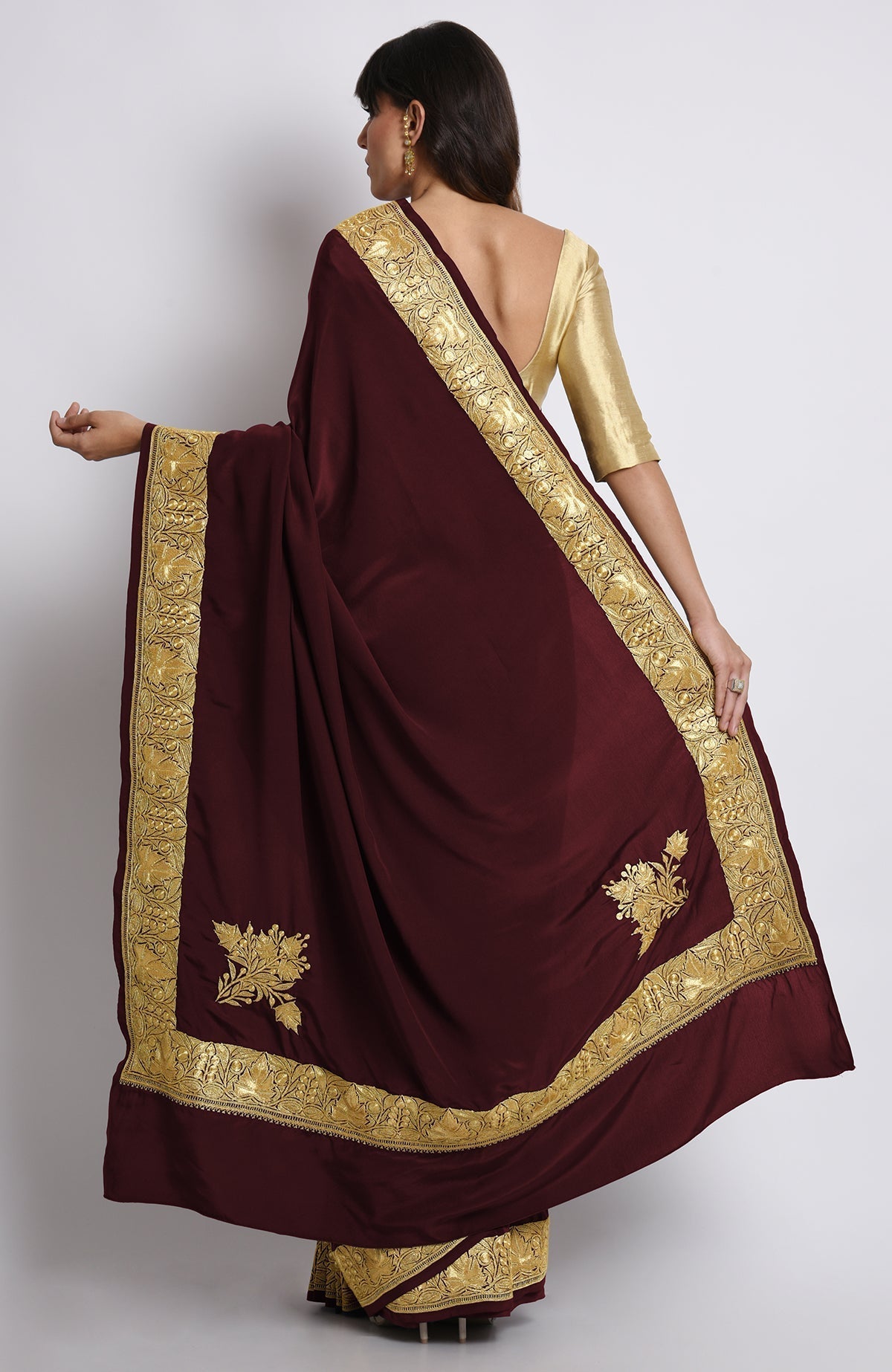 Burgundy pure crepe saree with gold Kashmiri tilla embroidery on pallav and borders