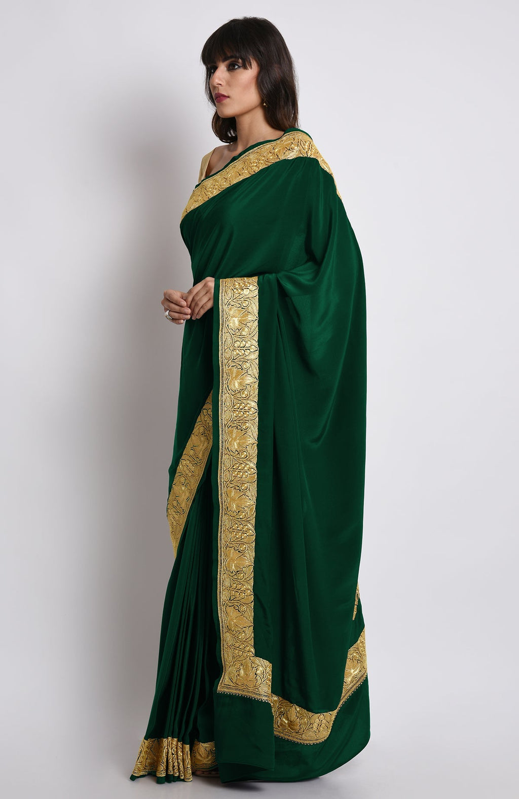 Emerald green pure crepe saree with gold Kashmiri tilla embroidery on pallav and borders