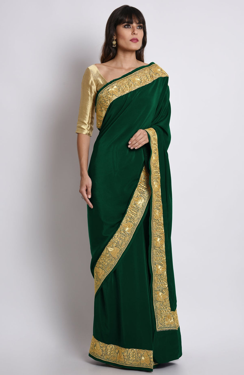Emerald green pure crepe saree with gold Kashmiri tilla embroidery on pallav and borders
