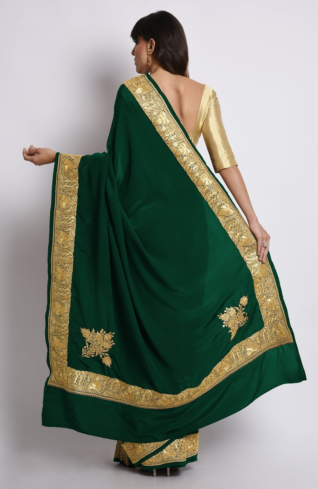 Emerald green pure crepe saree with gold Kashmiri tilla embroidery on pallav and borders